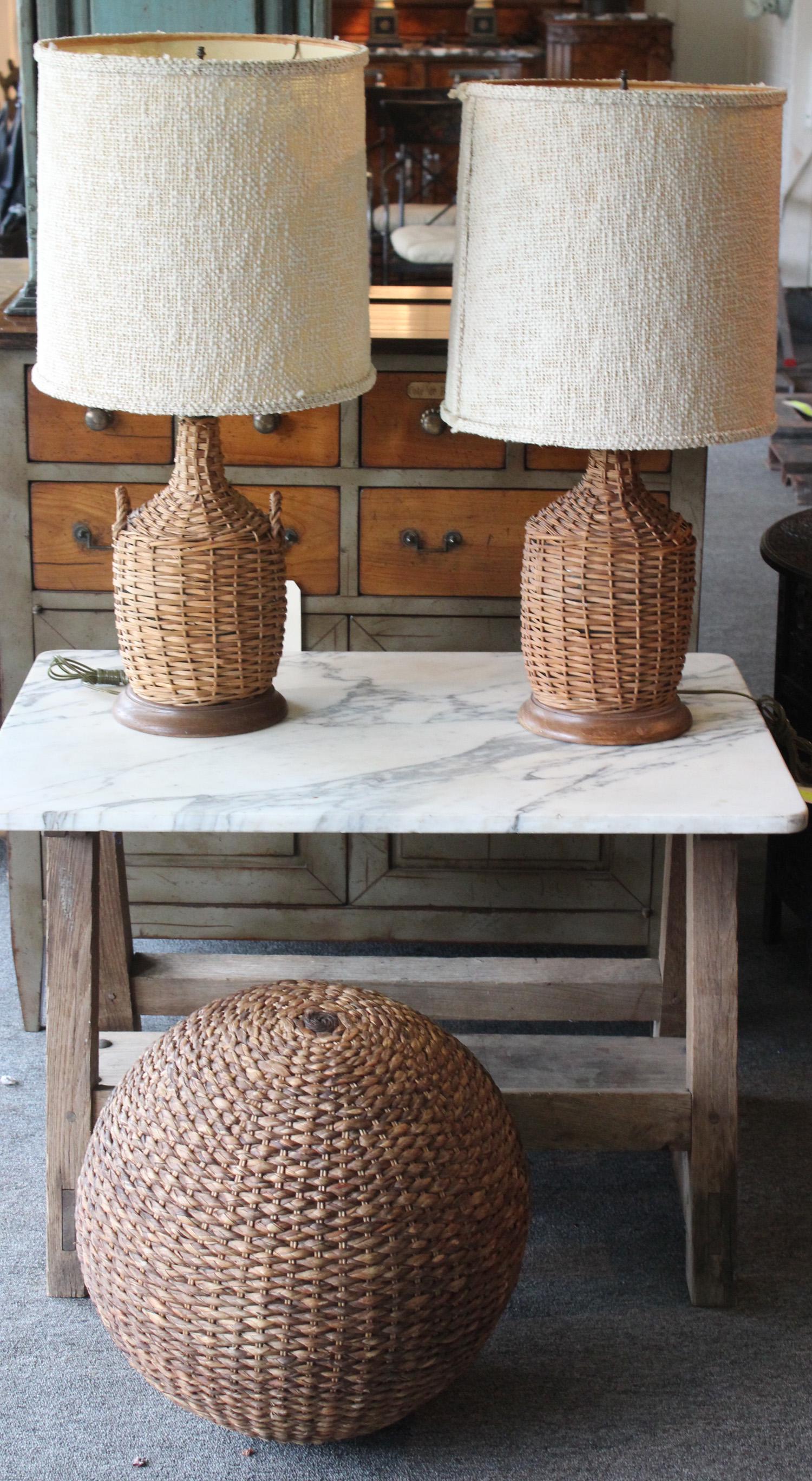 Summer House Decor Lot: A summer house lot including, similar pairs of wicker bottle lamps and a large woven ball. Size: Ball 15" dia. ***Please Note: This is an on-site online auction with specific Pick up terms and conditi