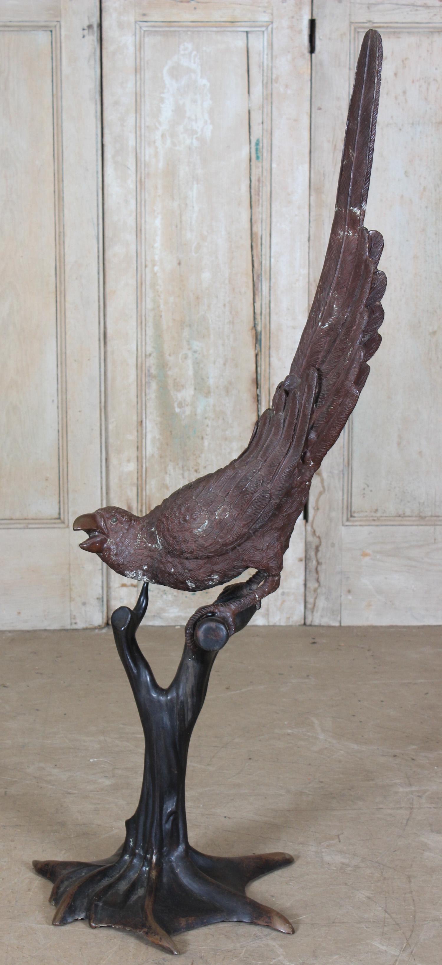 Life-sized Bronze Perched Parrot Sculpture: Life-sized Bronze Perched Parrot Sculpture. Size: 52" H x 18" W x 20" D