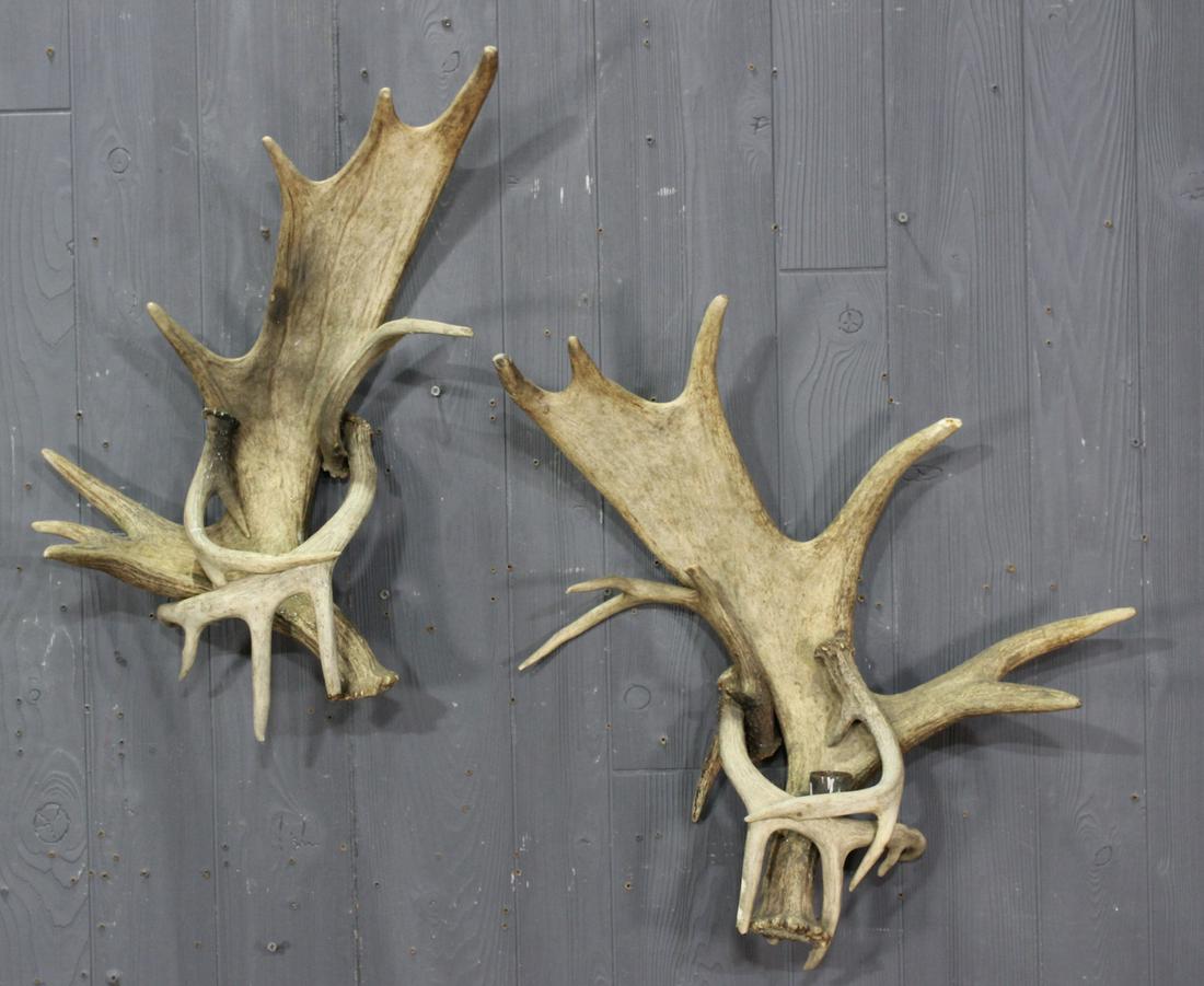 Lodge Decor Antler Sconces: Lodge Decor Antler Sconces. One missing its bobeche. Size: 24" H X 22" W X 8" D