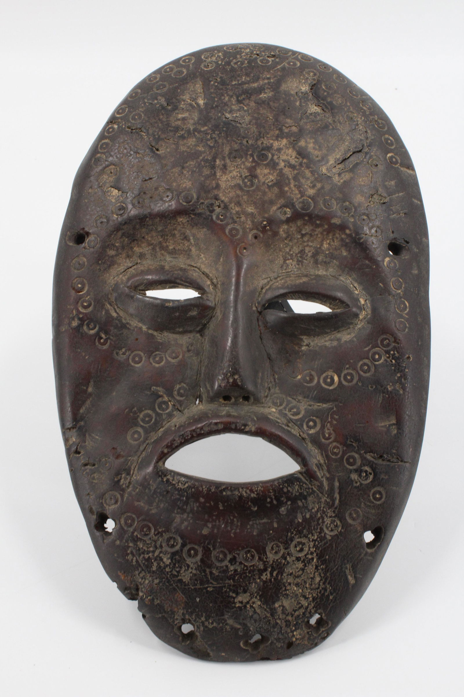 African Lega People Plastron Mask: African Lega People Plastron Mask. Fashioned from a naturally collected turtle plastron (bottom shell). 20th C, Congo. Size: 10.5" x 6"