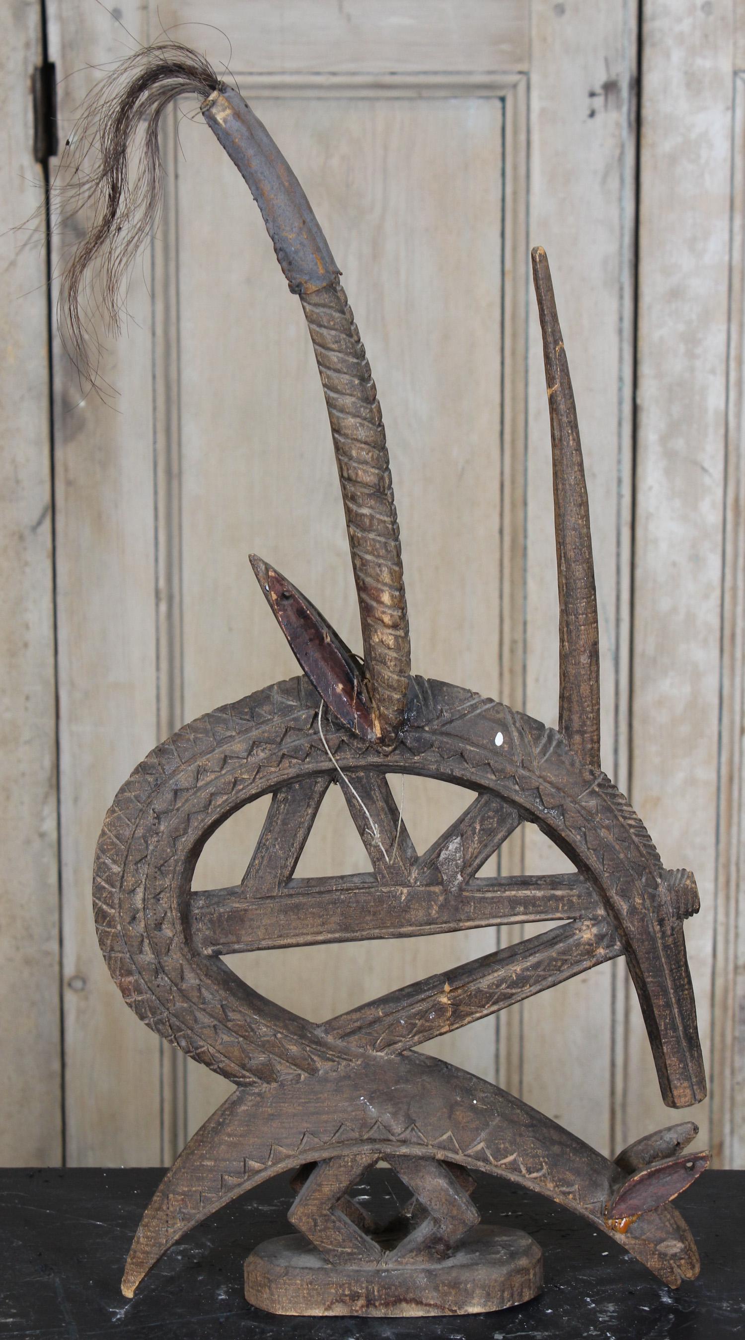 Bamabra People Chiwara Antelope Headdress: Bamabra People Chiwara Antelope Headdress. carved wood. Size: 22" H x 11.5" W x 3" D