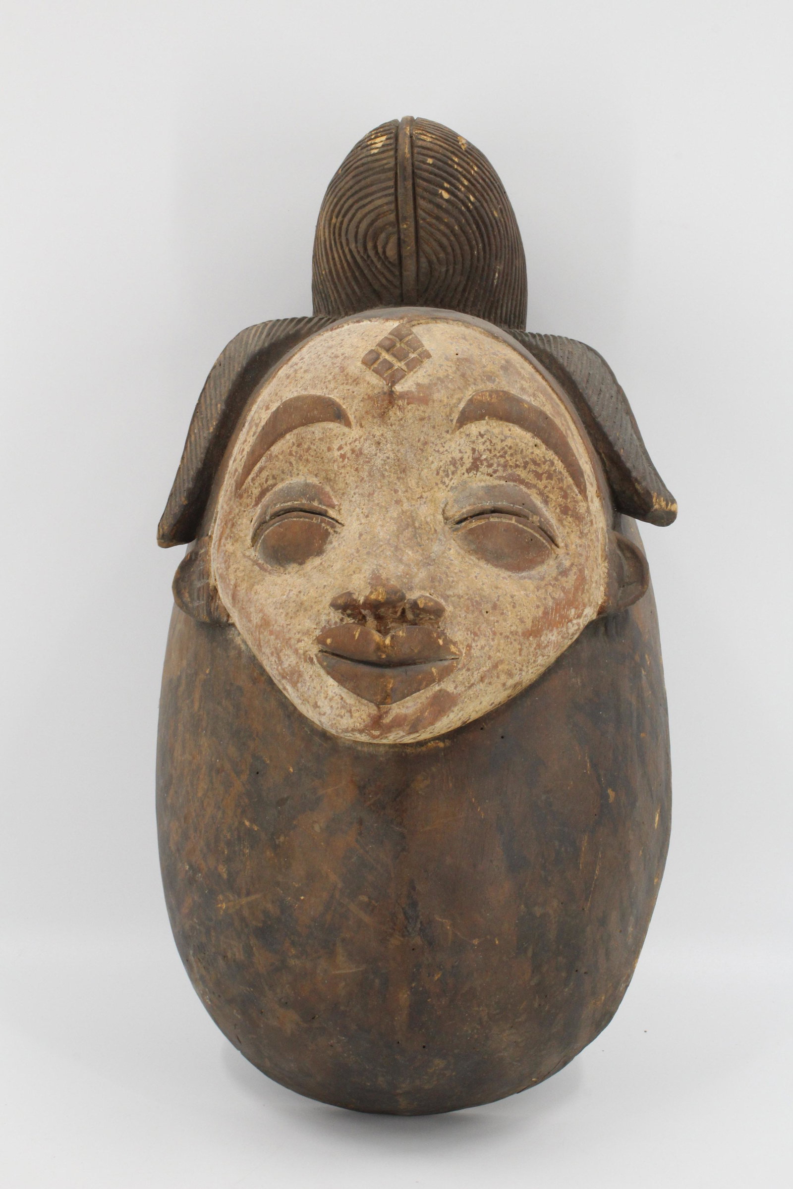 Punu Mask, Gabon: Punu Mask, Gabon. Carved wood. Size: 18" x 9" x 7"