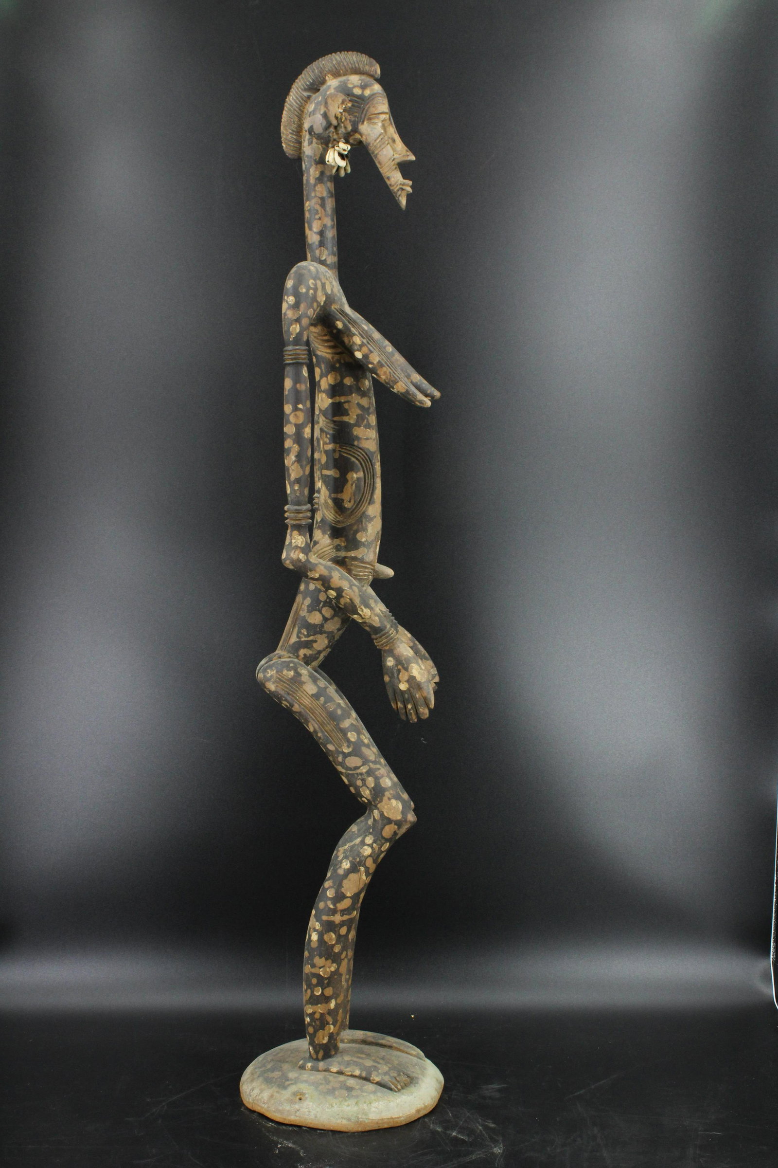 Senufo Figure: Senufo Figure. Carved wood. Size:49"h x 9.5"W x 9.5"D