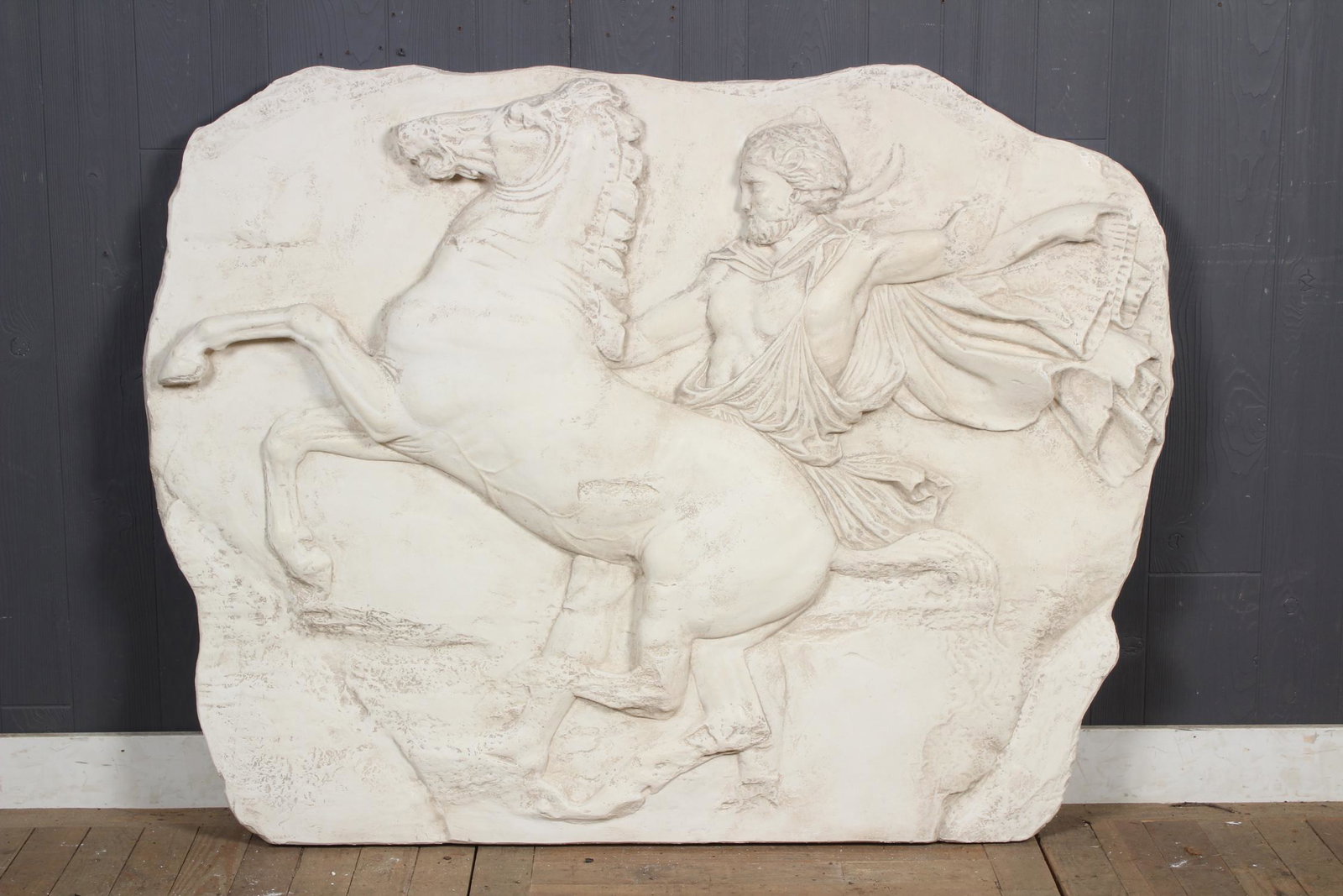 Caproni Style Parthenon Frieze: A large Caproni attributed plaster neoclassical figural frieze of two men on horse back. After the Antique. Size: 42" H x 54" W x 3" D