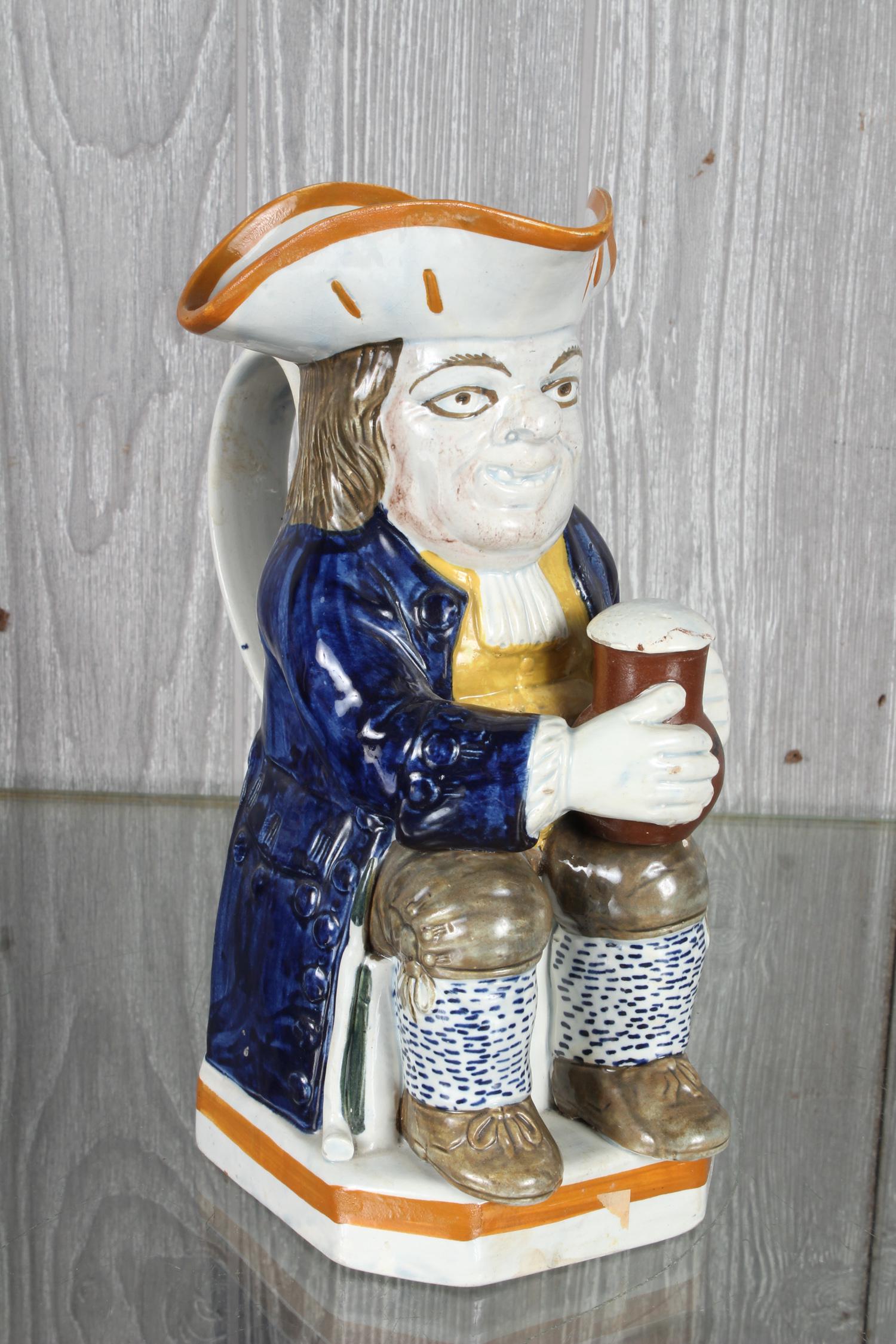 Ralph Wood Type Toby Jug: Ralph Wood Type Toby Jug, seated holding jug on knee with foaming beer, pipe resting aside right leg. Size 9 3/4" x 4 1/2" x 7".