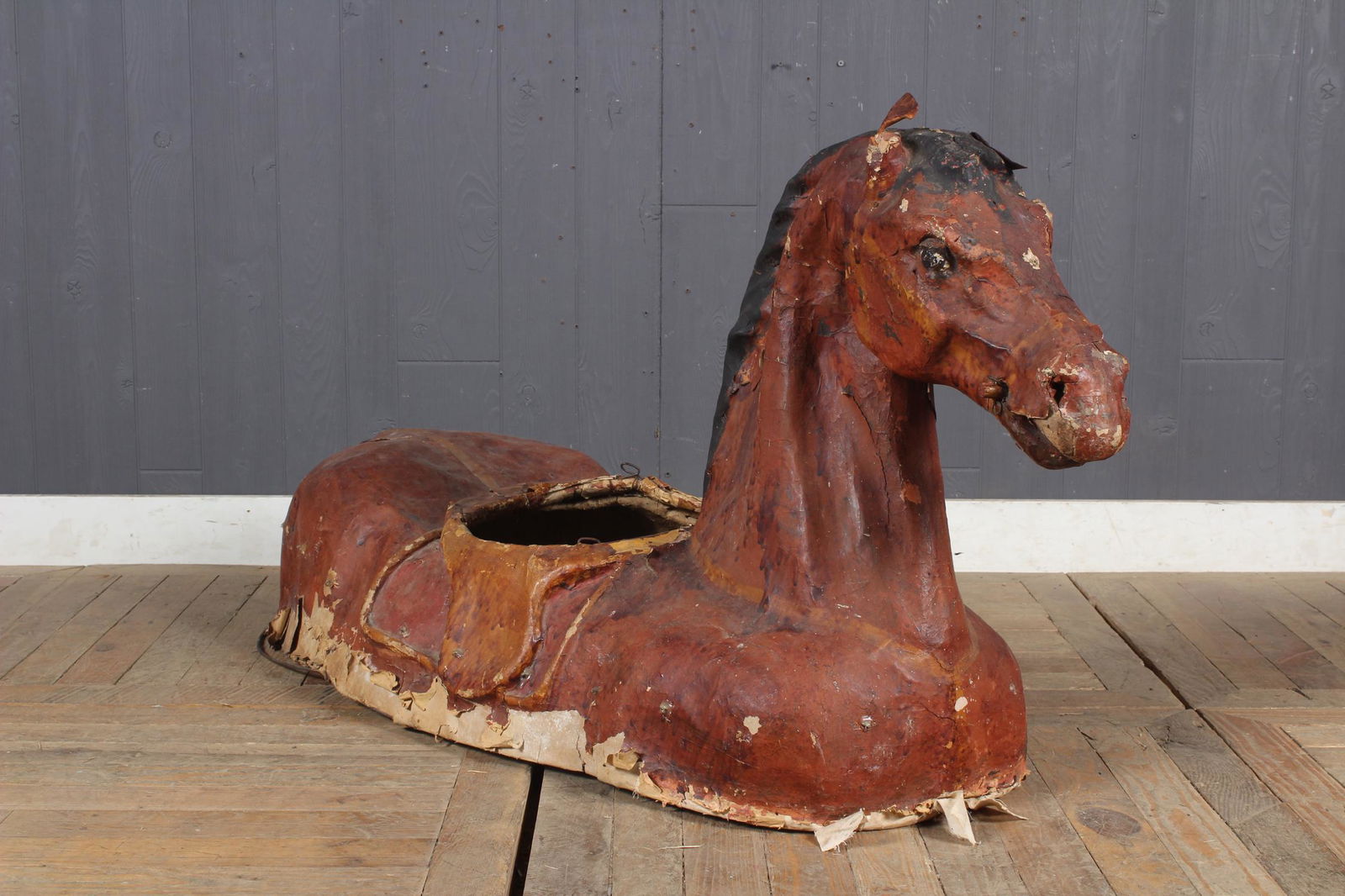Papier Mache Parade Horse: Antique papier mache theatrical or parade horse costume with upraised head and central hole for the wearer horse hair tale. Size: 28" H x 21" W x 57" D
