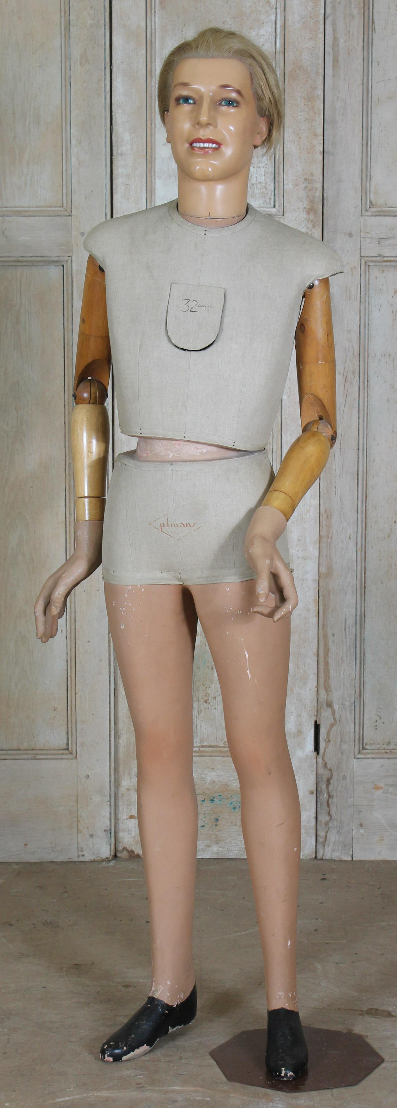 French Composition and Wood Mannequin: French Composition and Wood Mannequin, cloth covered torso, with makers stamped mark on front P. Imans Paris. Size: 71" H x 24" W x 16" D