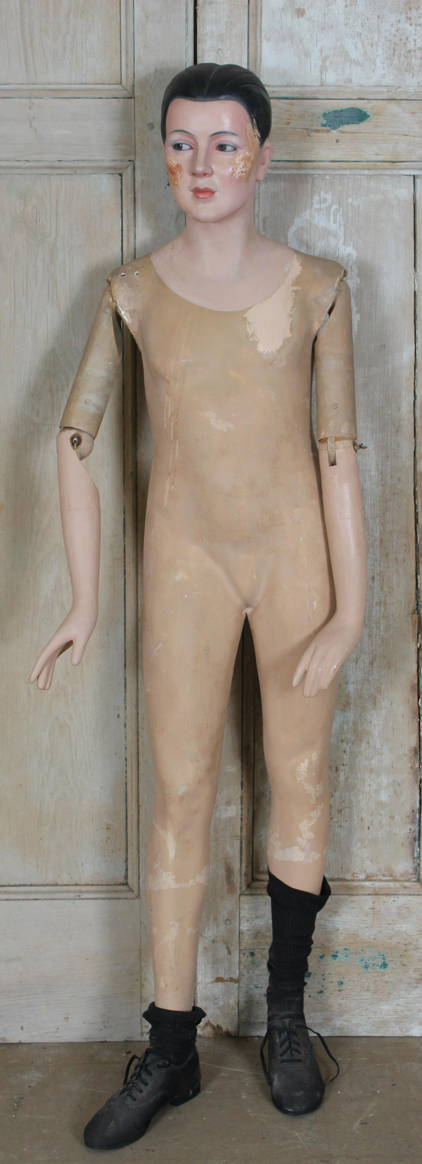 Composition and Wood Mannequin: Composition and Wood Mannequin, molded and painted features. Size: 60.5" H x 19.5" W x 15" D