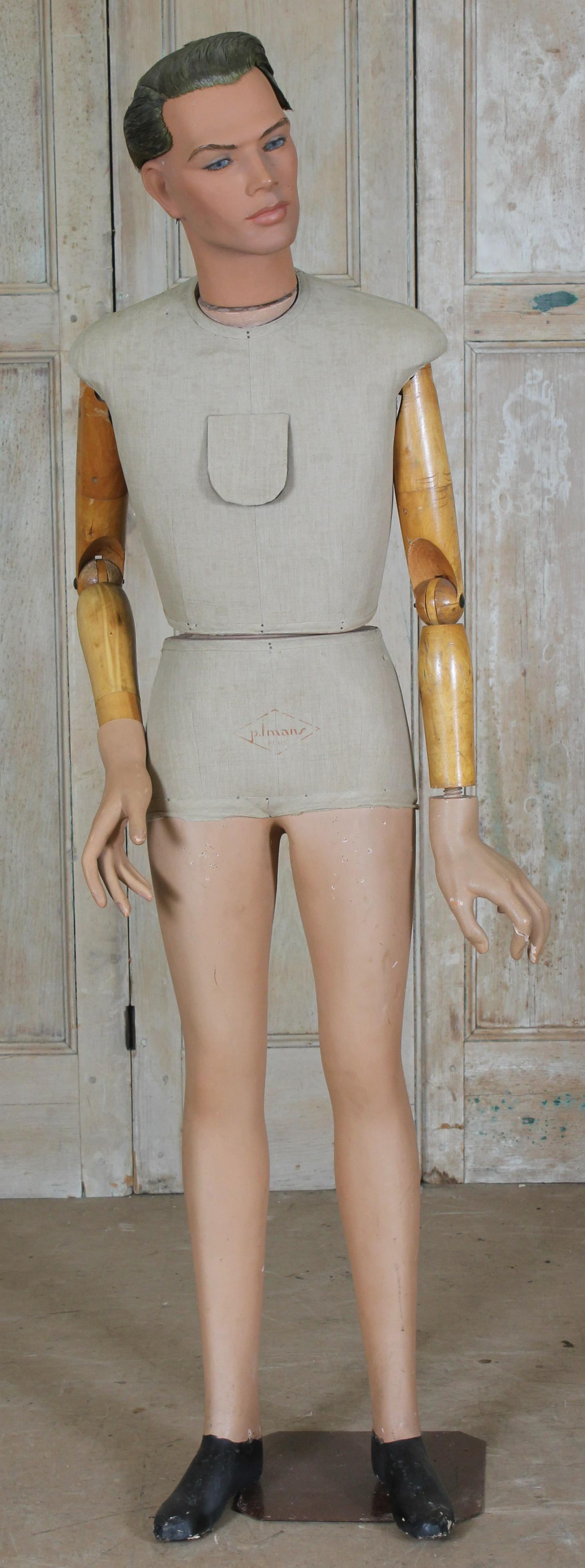 French Composition and Wood Mannequin: French Composition and Wood Mannequin, cloth covered torso, with makers stamped mark on front P. Imans Paris. Size: 70" H x 22" W x 16" D