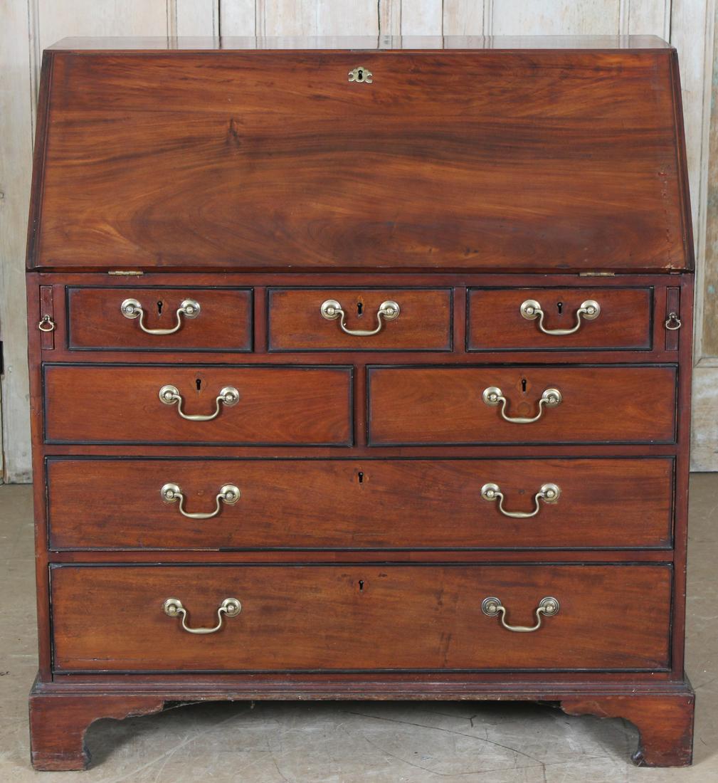 English George III Slant Front Chest: A good English George III slant front chest having fitted interior over seven drawers with ebonized trim all raised on bracket feet. Size: 42.5" H x 40.5" W x 22.5" D