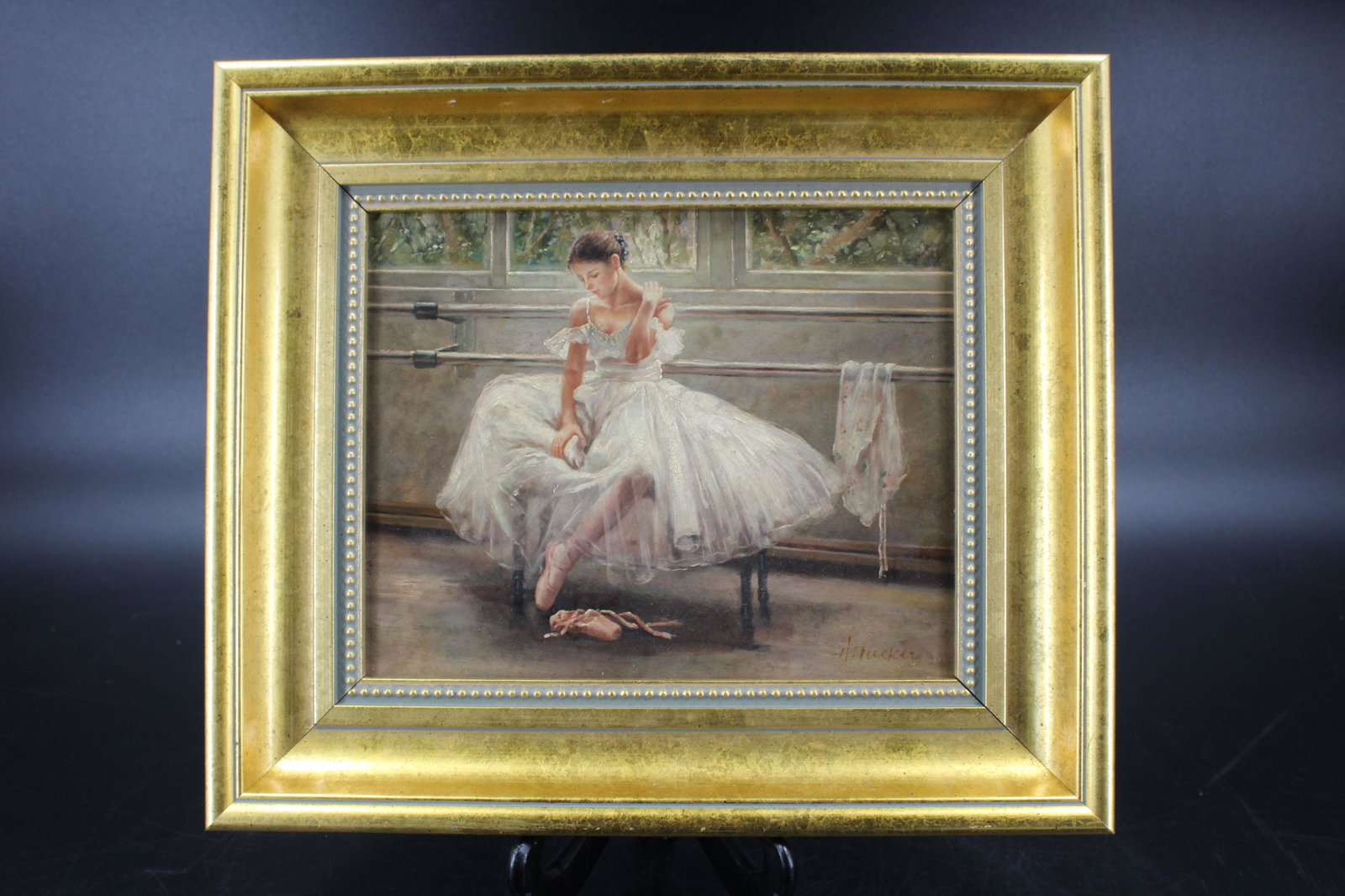 H. Tucker Oil on Board Ballerina Painting: H. Tucker Oil on Board Ballerina Painting, (European, 20th C.) depicting a seated ballerina, signed lower right H. Tucker. Size: Frame: 12.5" H x 14.5" W, Sight: 7.5" H x 9.5" W. (NHJ 349)