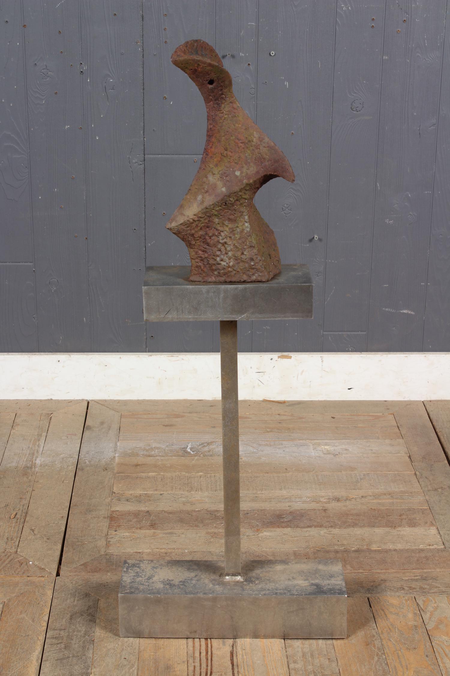 Signed Domingo Izquierdo Sculpture: A mid century modern abstract/ brutalism sculpture raised on stainless steel base. 36.5" H x 14" W x 5" D