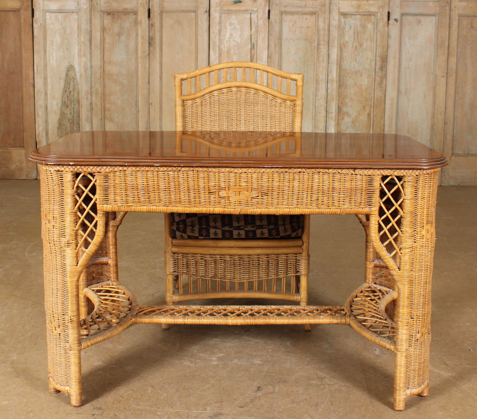Henry Link Wicker Desk and Chair: Henry Link Wicker Desk and Chair, both labeled. Size: Largest: 30.5" H x 48" W x 27" D