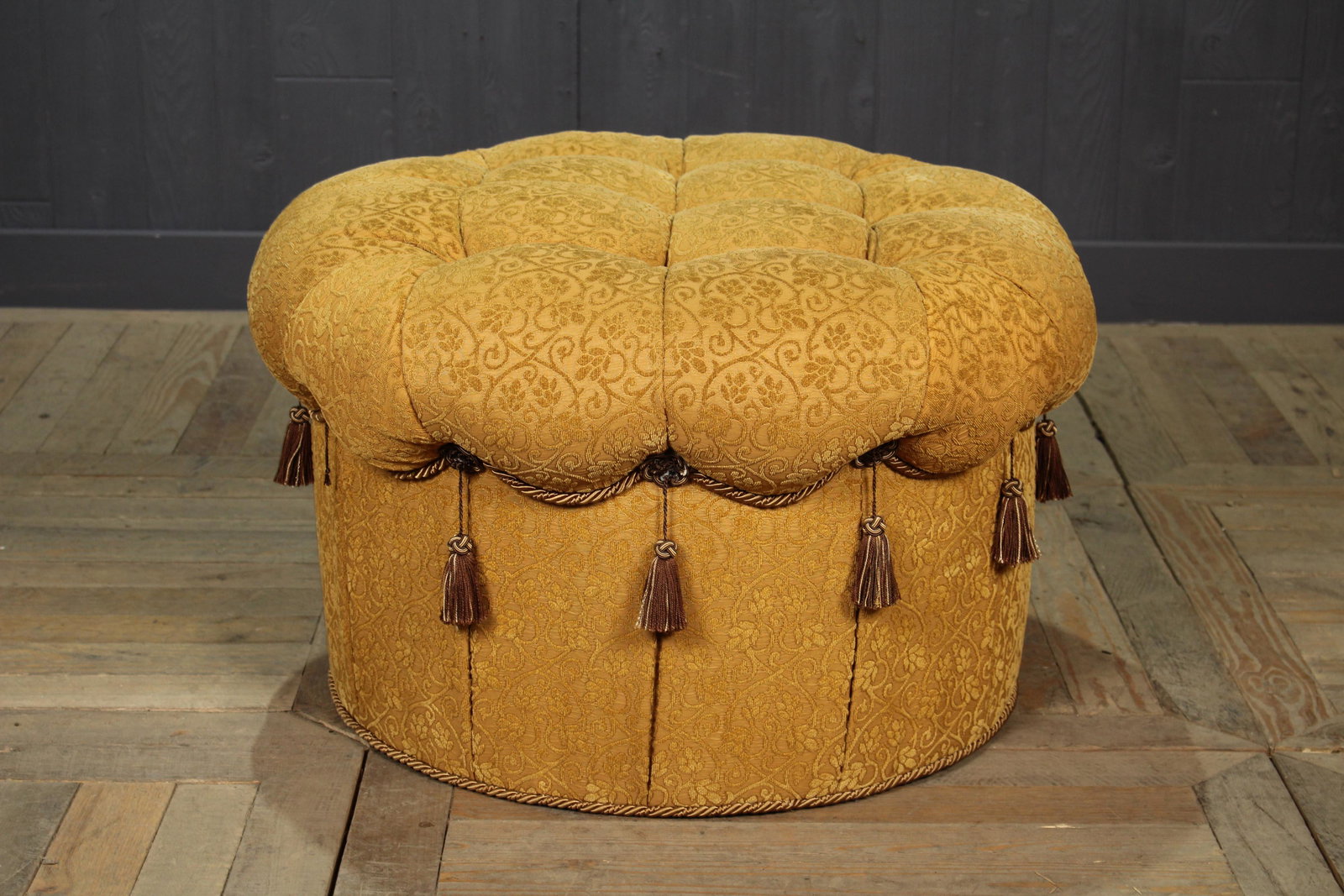 Tufted Damask Upholstered Ottoman: Tufted Damask Upholstered Ottoman. Size: 18" x 28" diameter.