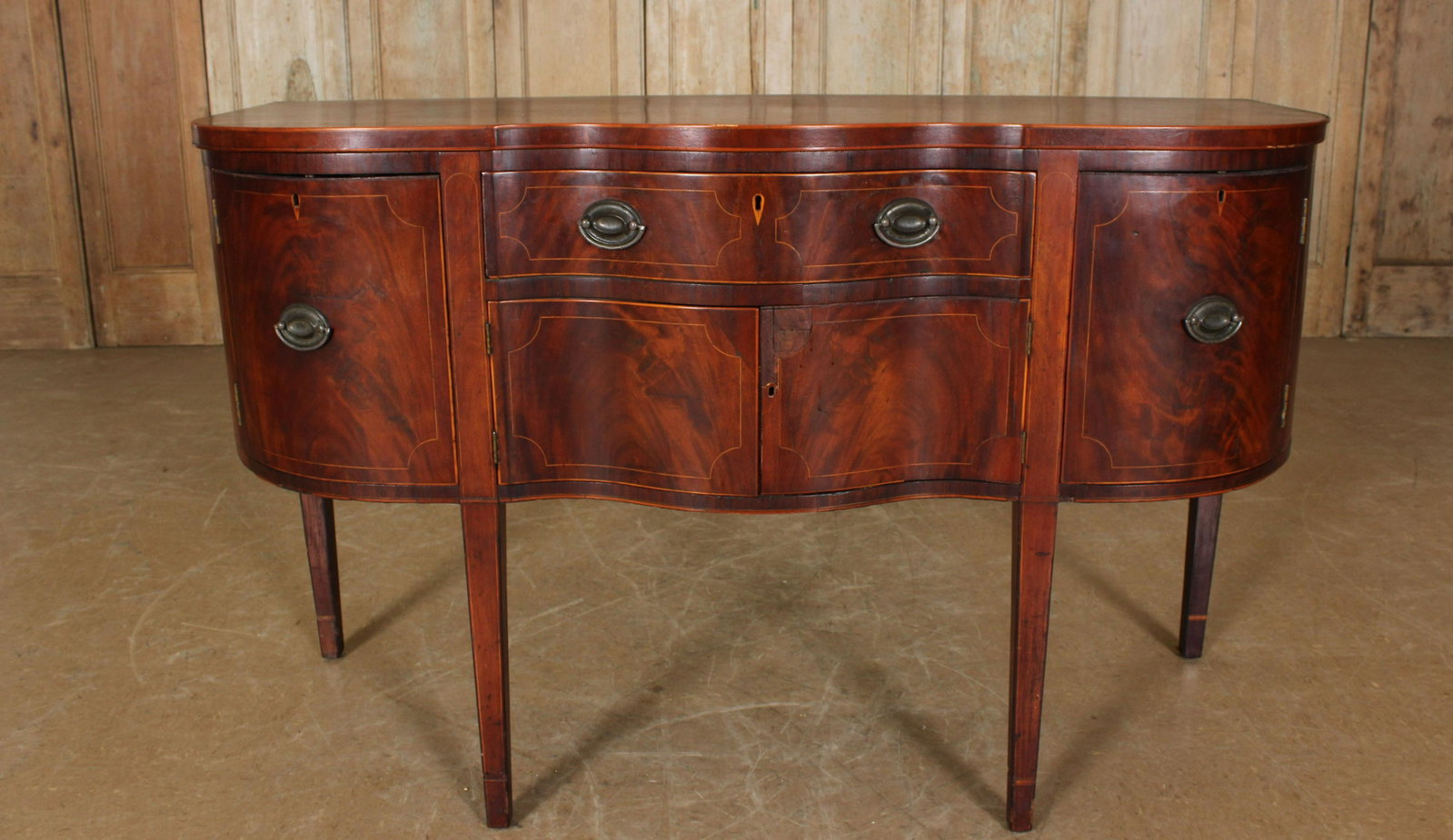 American Early 19th C. Serpentine Front Sideboard: American Early 19th C. Serpentine Front Sideboard. Size: 37.5" H x 61" W x 23.25" D