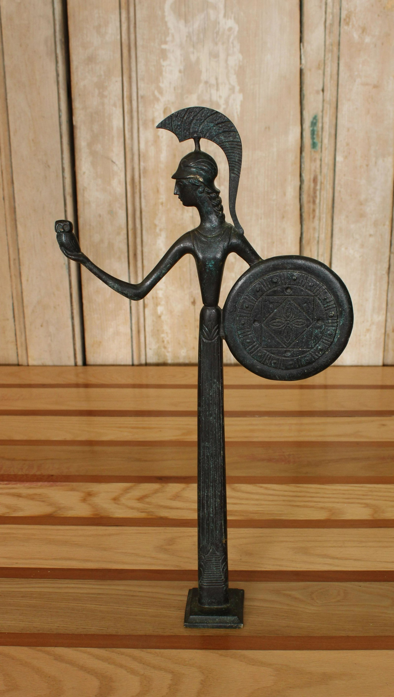 Mid Century Modern Bronze Figure of Athena: Mid Century Modern Bronze Figure of Athena holding an owl in one hand and wielding a shield in the other hand. Size: 16.75" H x 9" W x 2" D