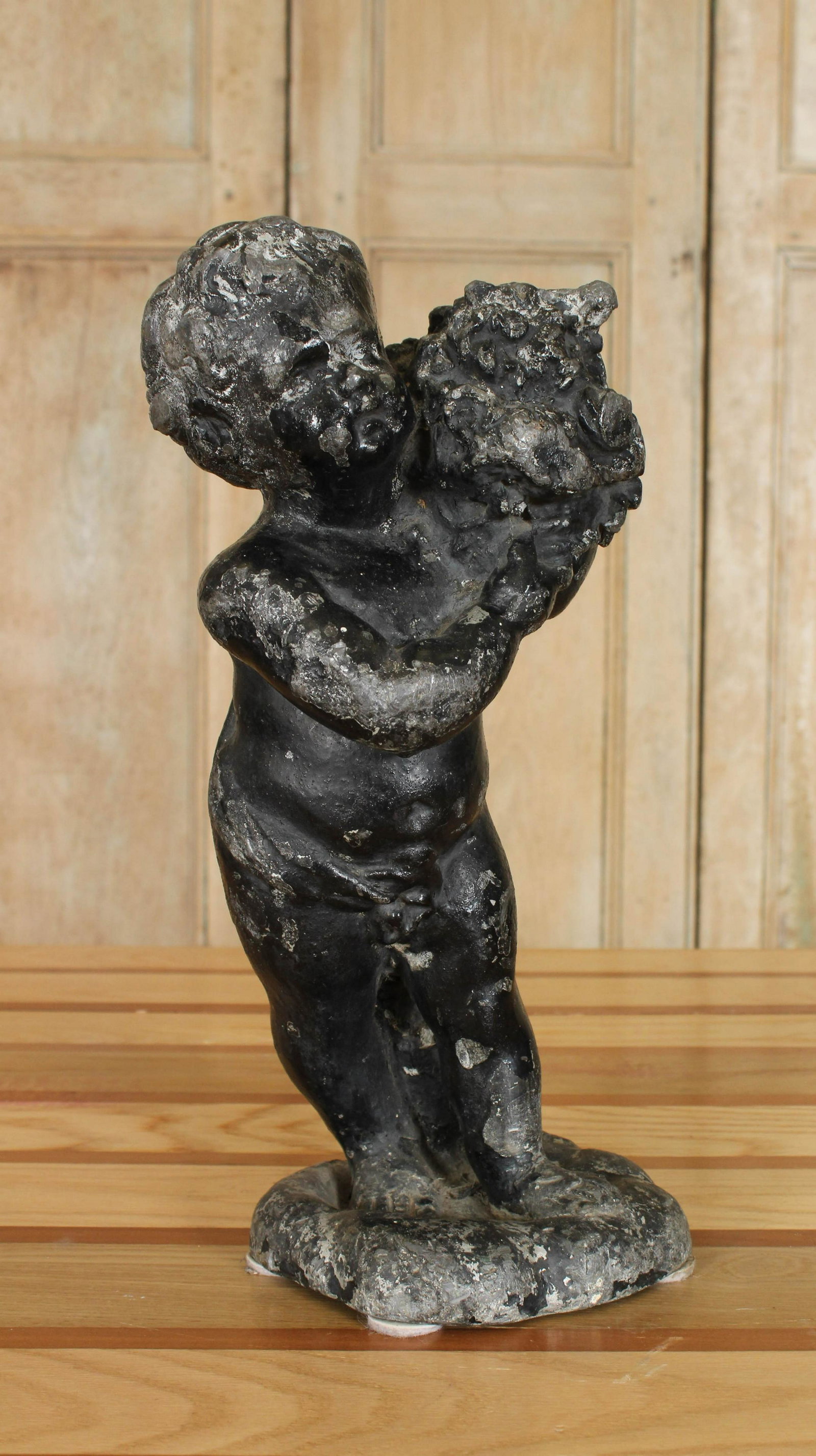 Cast Lead Figural Putti Garden Ornament: Cast Lead Figural Putti Garden Ornament. Size: 14.75" H x 6.25" W x 5.75" D