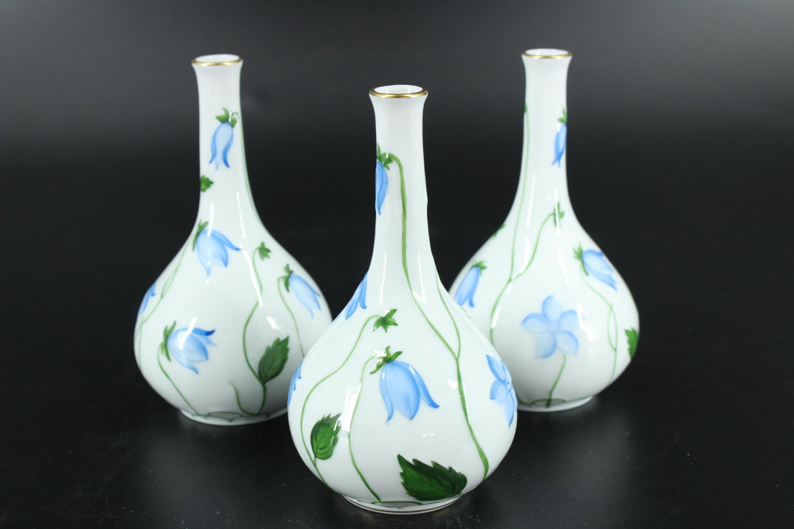Set of 3 Herend Porcelain Bud Vases: Set of 3 Herend Porcelain Bud Vases, blue floral decoration, each hallmarked on bottom and numbered 7144/C. Size: 5.5" H x 3" W x 3" D.