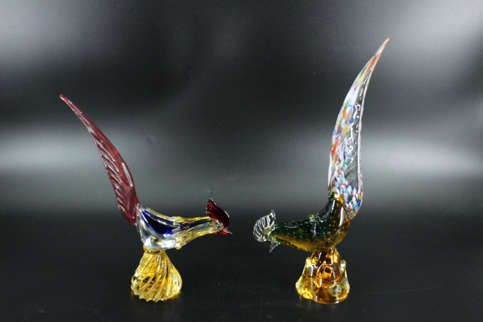 2 Venetian Art Glass Rooster Figurines: 2 Venetian Art Glass Rooster Figurines, Murano or Murano style bird sculptures. Size: 16.5"H x 3.5"W x 6.5"D