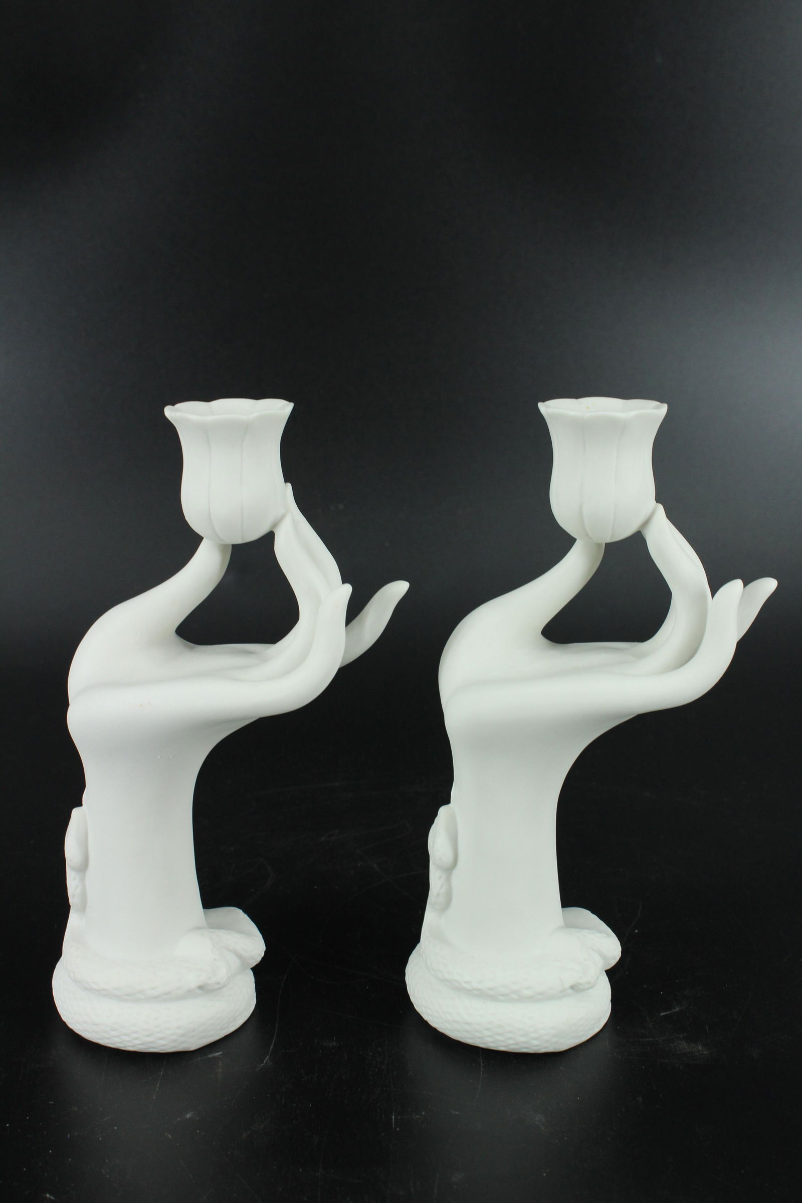 Pair of Jonathan Adler Eve Ceramic Candle Holders: Pair of Jonathan Adler Eve Ceramic Candle Holders, snake wrapped around base of hand, both labeled on bottom. Size: 7.25"H x 2.5"W x 4.5"D