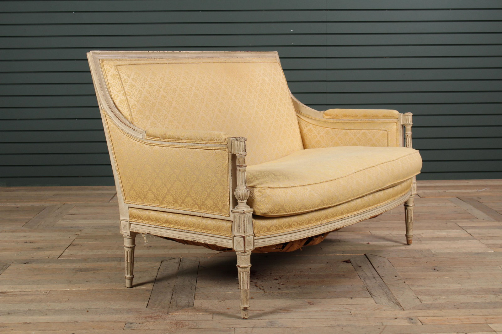 French Louis XVI Style Carved & Painted Settee: French Louis XVI Style Carved & Paint Decorated Settee, having tailored back and downswept arms, framing a loose cushion seat. Size: 33" H x 49" W x 26" D.