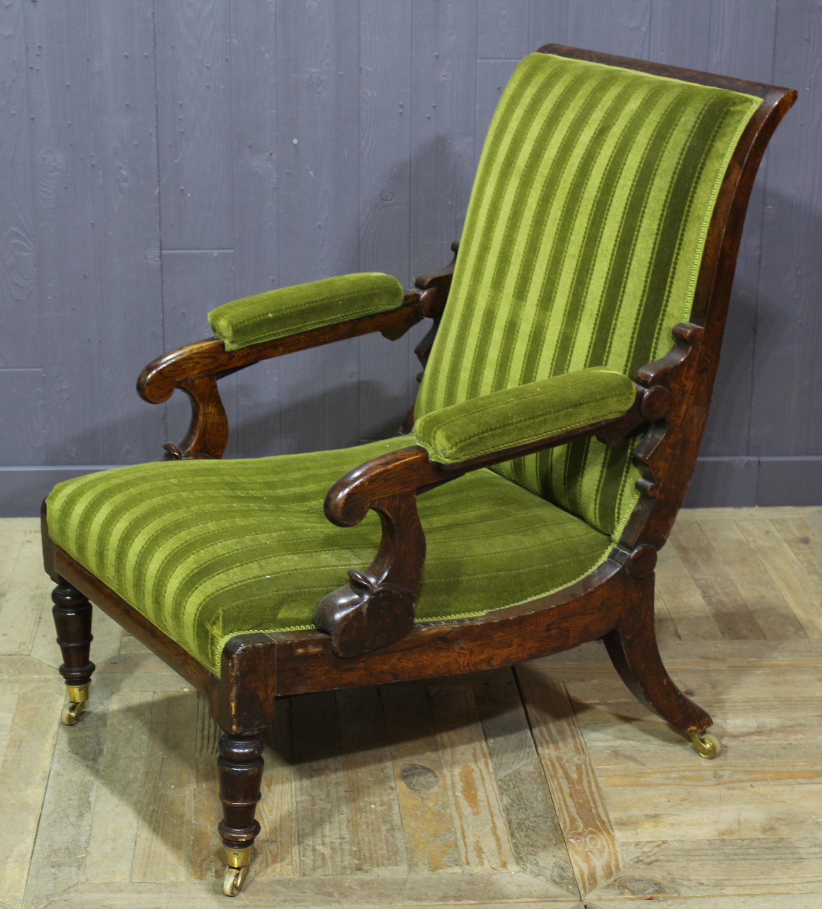 William IV Mechanical Reclining Armchair: William IV Mechanical Reclining Armchair, with reclining back to library chair, with brass pulls along seat of chair, with adjustable foot rest. Size: 41" x 27" x 37"