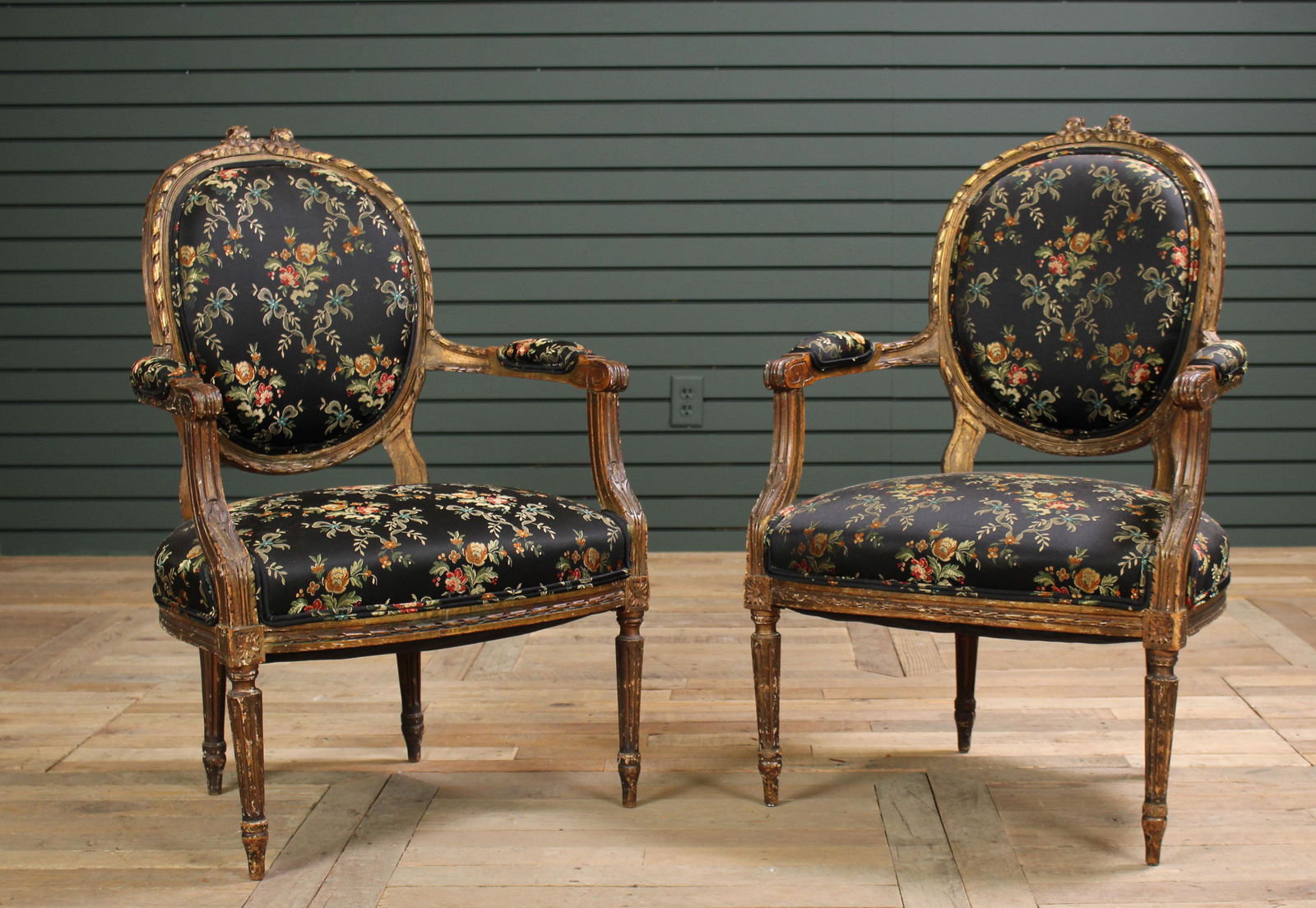 Pair of 19th C. French Giltwood Carved Fauteuils: Pair of 19th C. French Gilt Wood Carved Fauteuils/ arm chairs having carved back over open arms, all supported on turned feet and fluted legs. Size: 36" H x 25" W x 25" D.