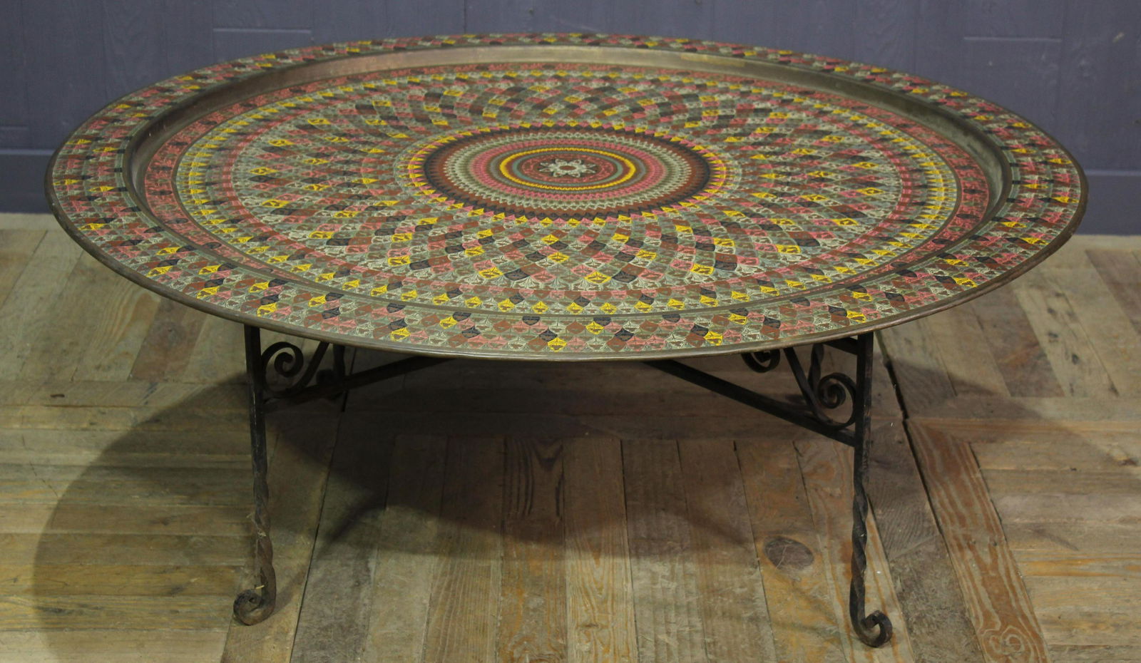Large Middle Eastern Enameled Brass Tray on Stand: Large Poly Chrome Middle Eastern Brass Tray on Wrought Iron . Size: 48" diameter