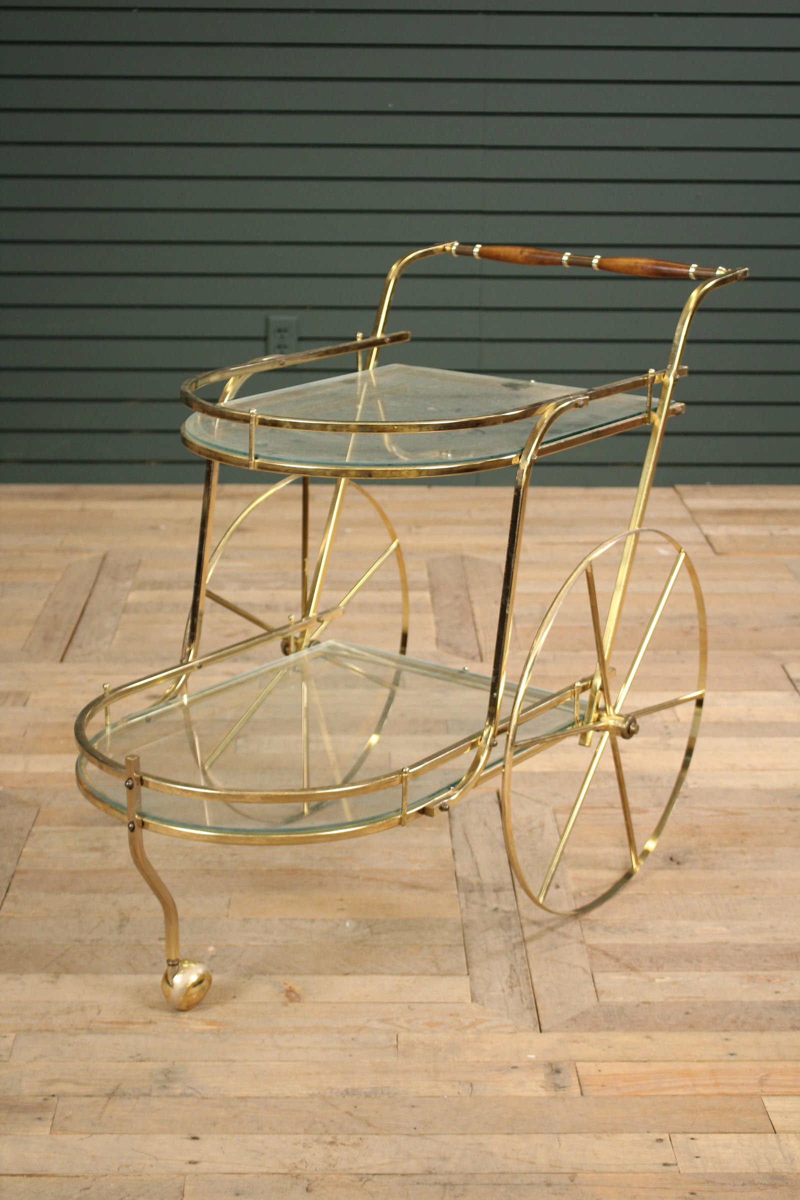 Italian Modern Brass and Glass 2-Tiered Bar Cart: Italian Modern Brass and Glass 2-Tiered Bar Cart, glass shelves, brass spoke wheels, wooden handle. Size: 32"H x 21"W x 38"D