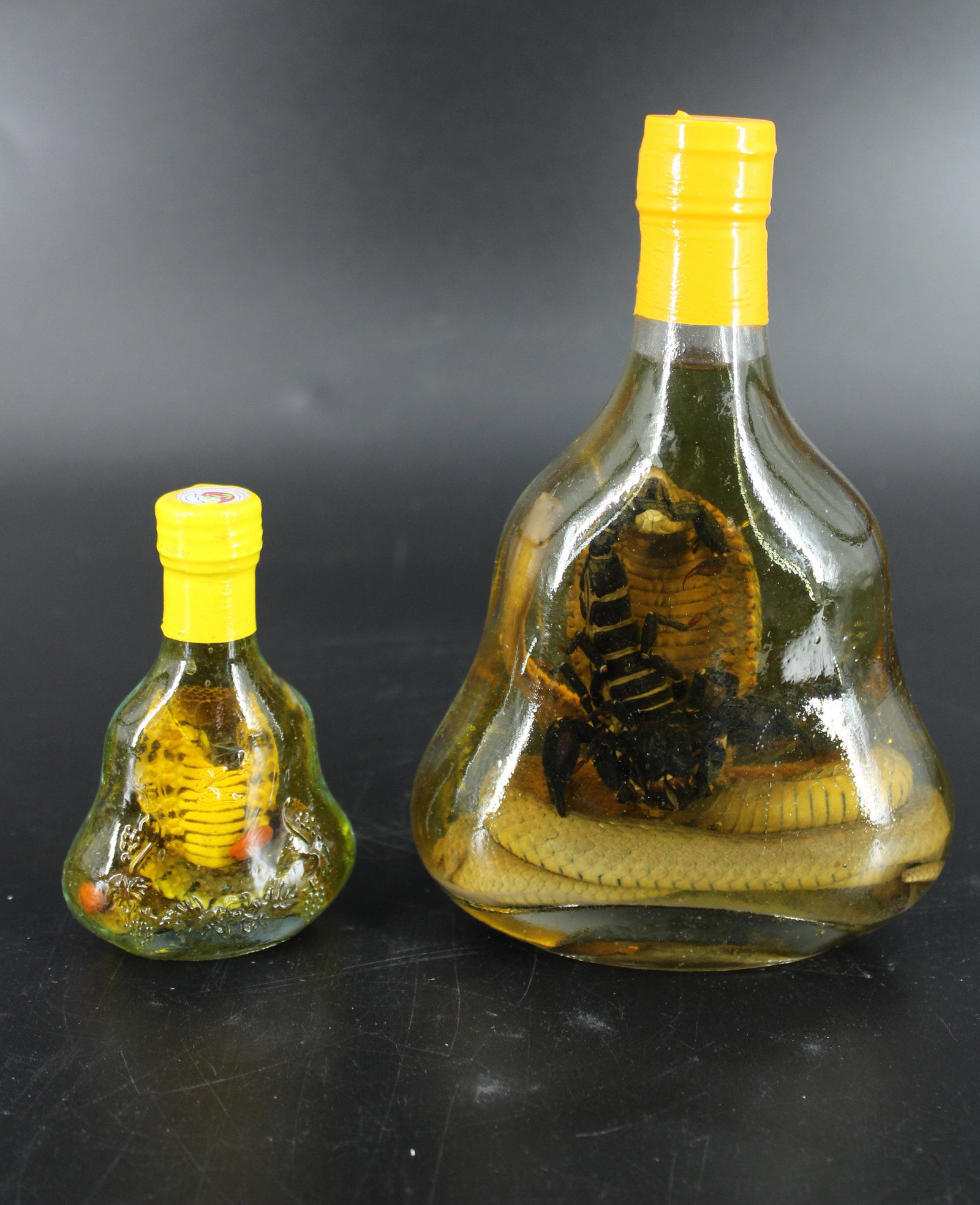 Bottled Cobra and Scorpion & Bottled Cobra: Bottled Cobra and Scorpion & Bottled Cobra, Vietnamese whiskey or wine medicinal bottles. Size: 7"H x 5"W x 2.5"D