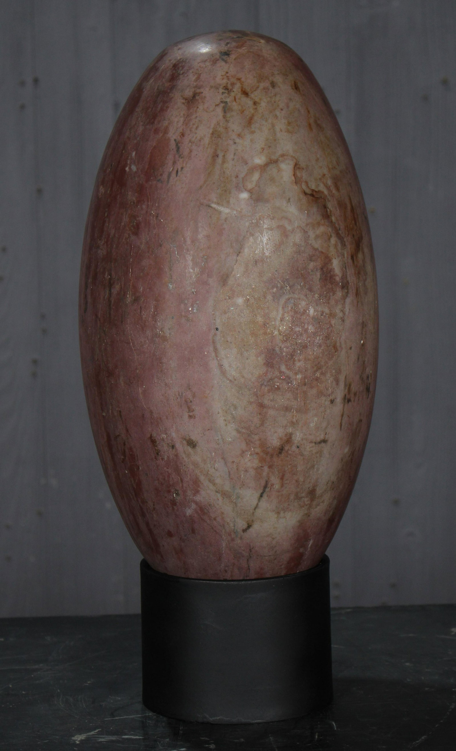 15" Shiva Lingam Stone: Shiva Lingam Stone. Size: 15" x 7.5" diameter. 18" overall height on stand.