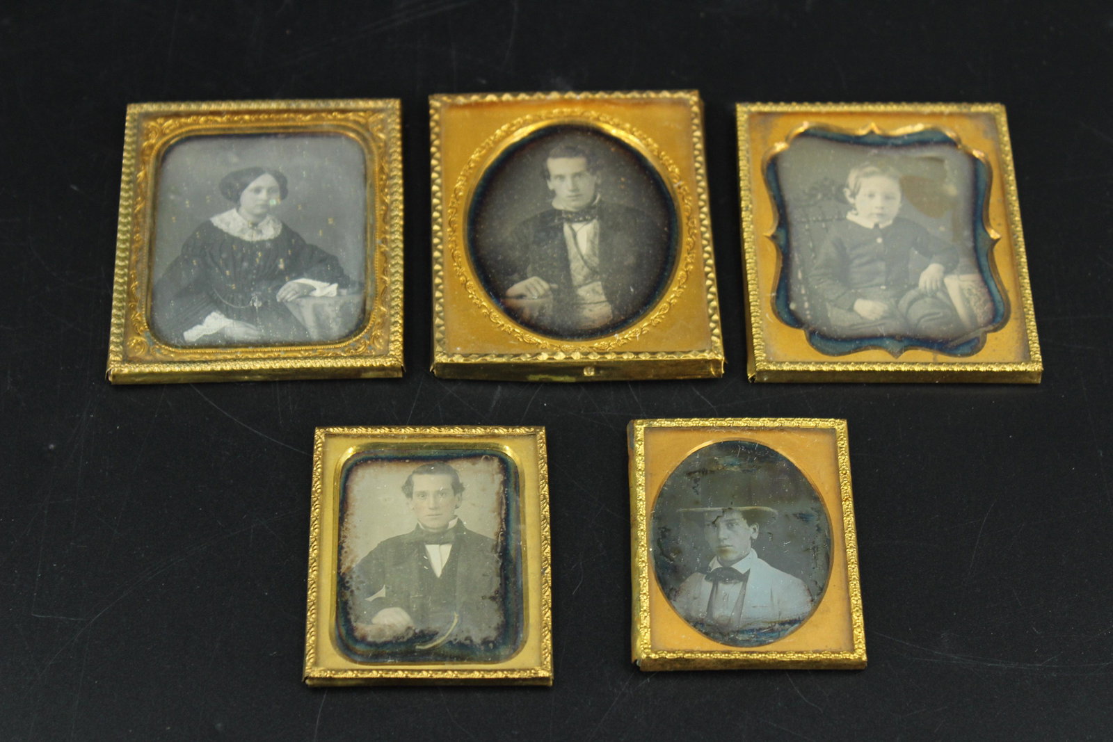 5 Daguerreotype Portraits: 5 Daguerreotype Portraits, sixth plate and ninth plate, including a young woman, young boy, and three young men. Size: 3.25"H x 2.75"W