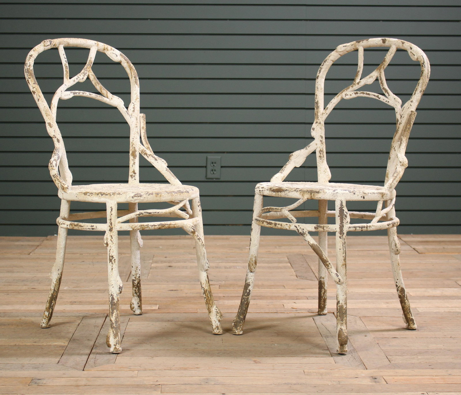 Pair of Painted Metal Faux Bois Garden Chairs: Pair of Painted Metal Faux Bois Garden Chairs with stylized back and round seat. Size: 36" H x 17.5" W x 18" D.