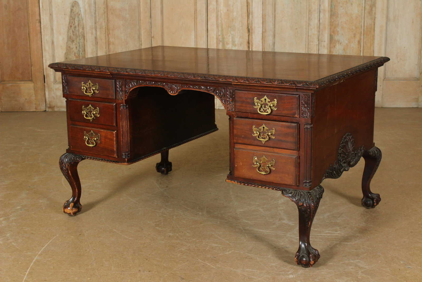 Chippendale Style Carved Mahogany Partners Desk: Chippendale Style Carved Mahogany Partners Desk having gadrooned top over drawers, all supported on cabriole legs with ball and claw feet. Size: 30.5" H x 54" W x 35.75" D