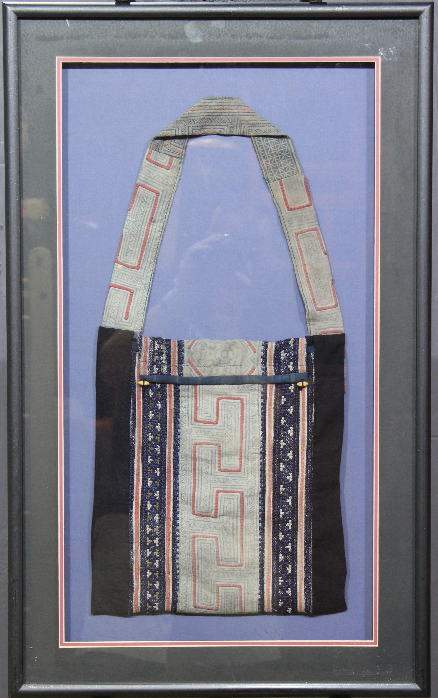 Framed Chinese Minority Miao Textile Satchel: Framed Chinese Minority Miao Textile Satchel. Size: Frame: 32.5" H x 20" W x 1.5" D; Sight: 24.5" H x 11.5" W