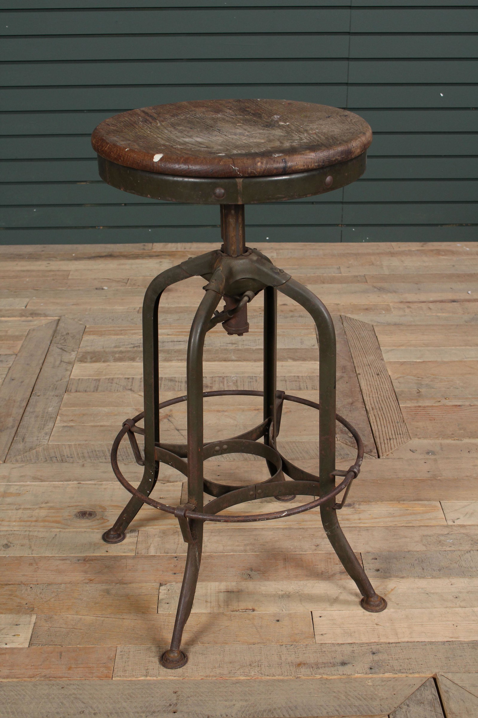 Labeled Vintage Industrial Adjustable Stool: Labeled Vintage Industrial Adjustable Stool having a wood seat and metal frame. Size: 29" H x 16" W.