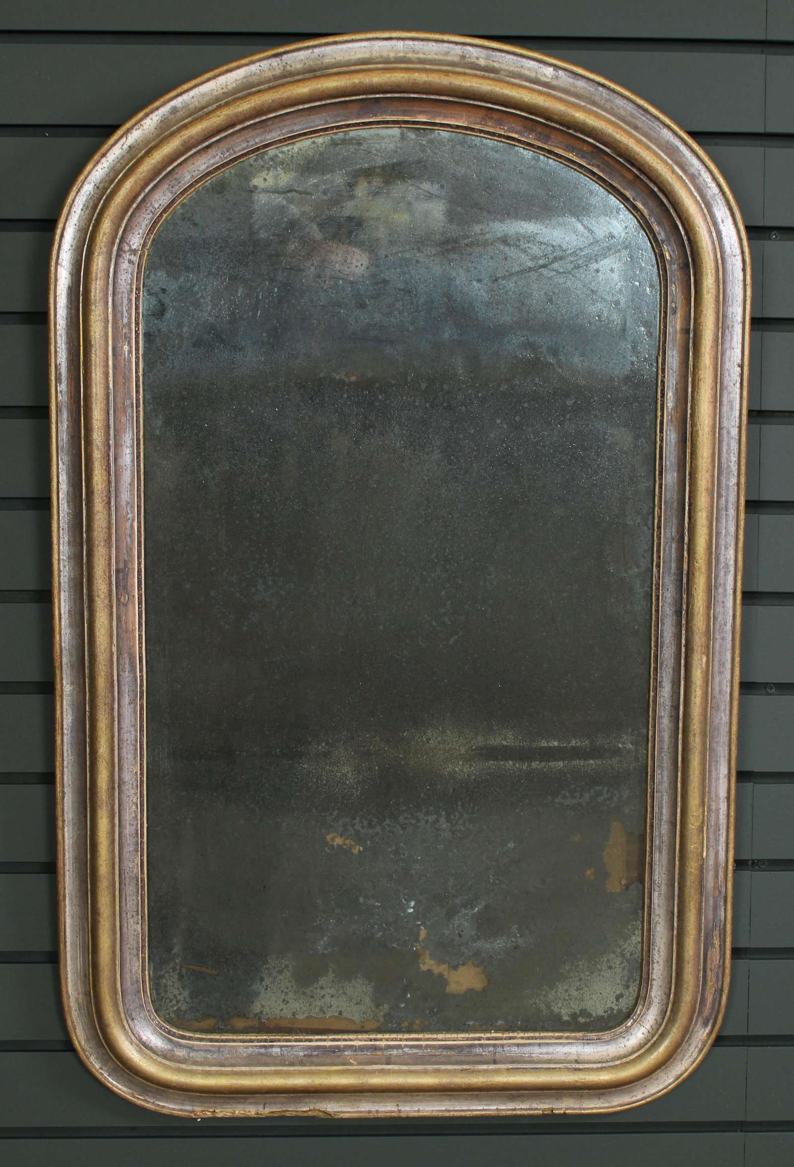 19th C. Silver Gilt Mirror: 19th C. Silver Gilt Mirror having a thumb molded frame and early mirror panel. Size: 35.5" H x 22" W.
