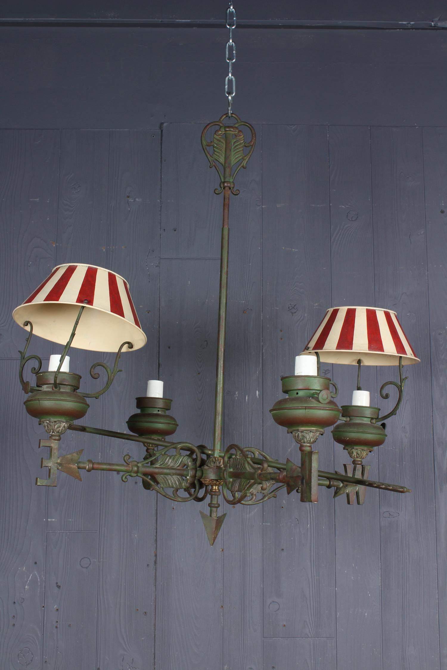 Weathervane Motif Iron Chandelier: Weathervane Motif Iron Chandelier. With 4 lamps set atop a compass point. Size: 28.5" H x 28.5" W x 25" D