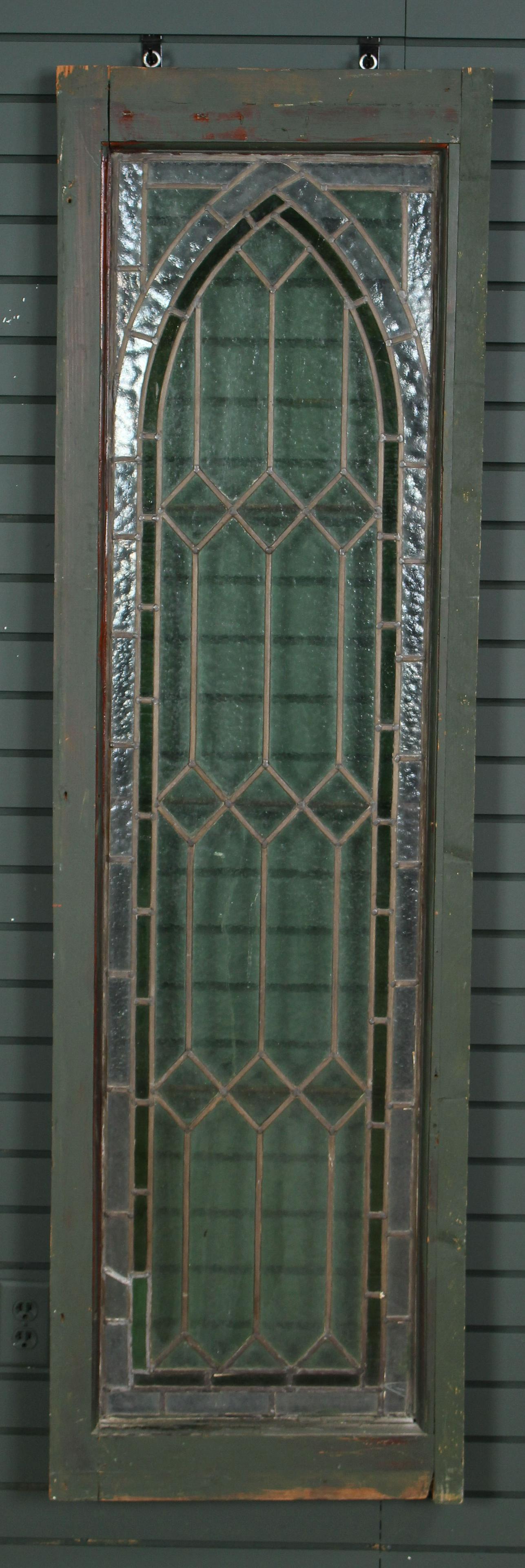 Antique 2 Color Stained Glass Window: Antique 2 Color Stained Glass Window having an arched design and wood frame. Size: 72.5" H x 21" W.