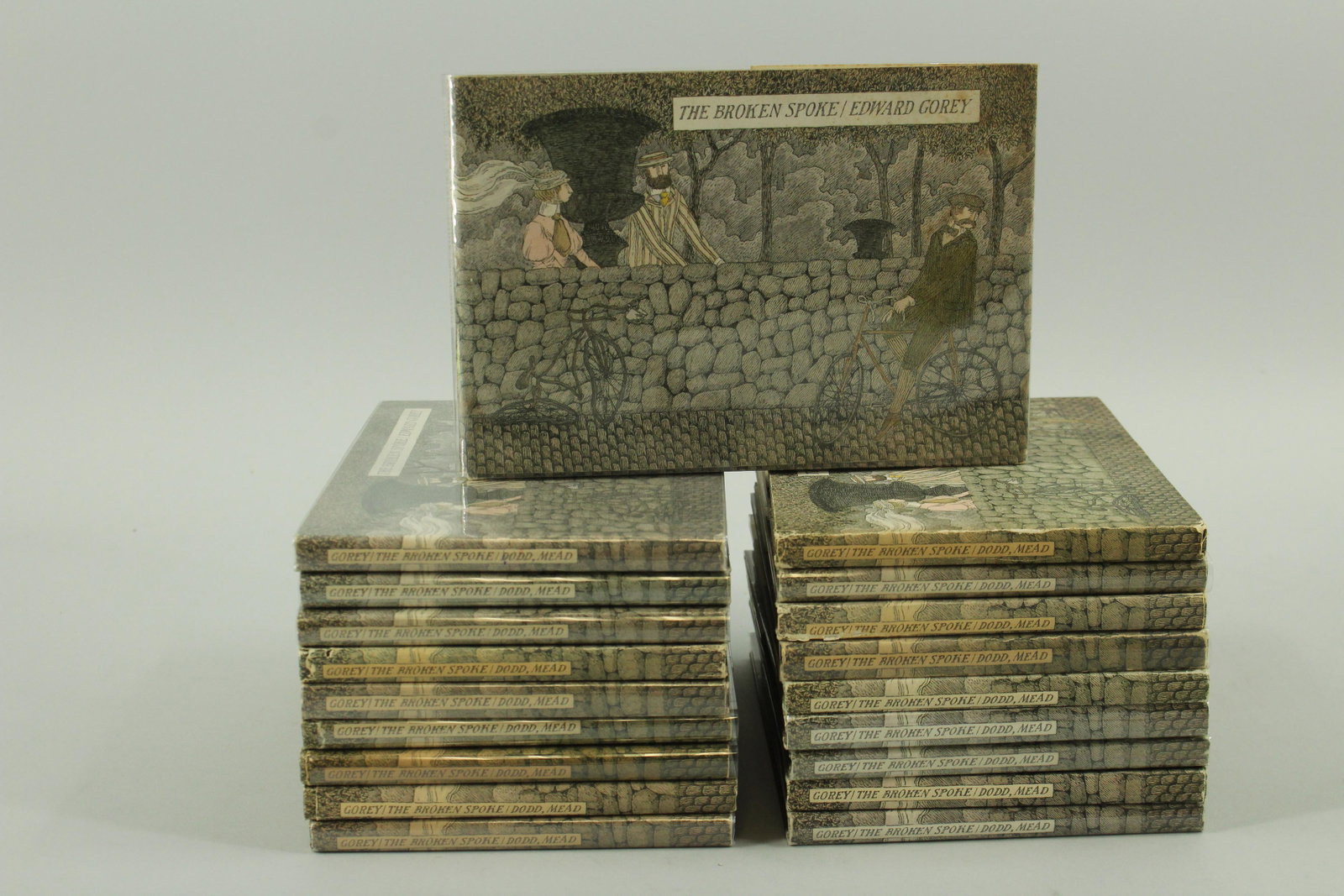 The Broken Spoke by Edward Gorey 19 copies: 19 copies of "The Broken Spoke" by Edward Gorey, Dodd Mead 1976, one is signed but is stained, some copies show wear.