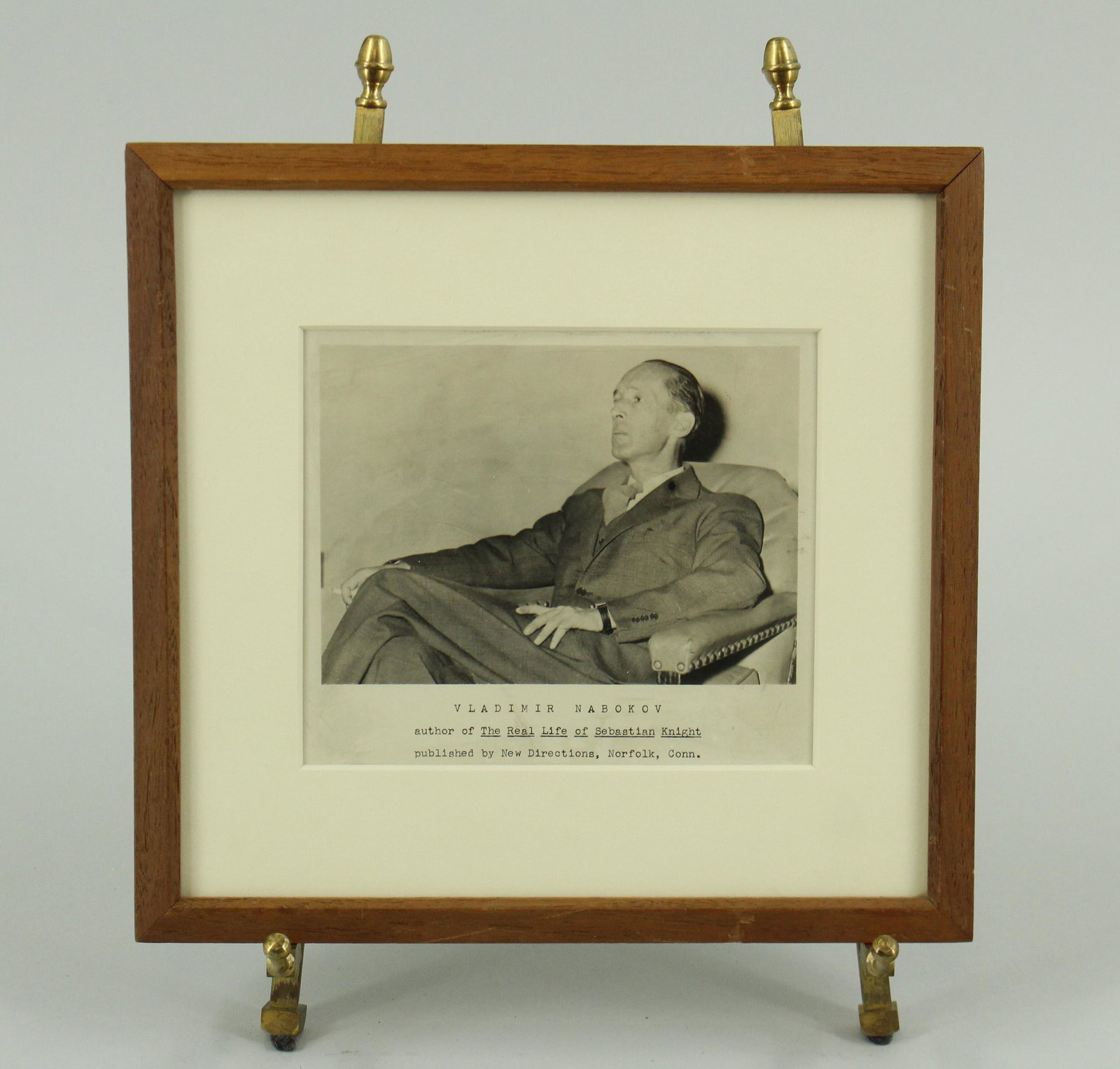 Framed Photograph of Vladimir Nabokov: Framed Photograph of Vladimir Nabokov, Russian/ American novelist and poet. Photograph with text below "Vladimir Nabokov, author of the Real Life of Sebastian Knight, published by New Directions, Norf