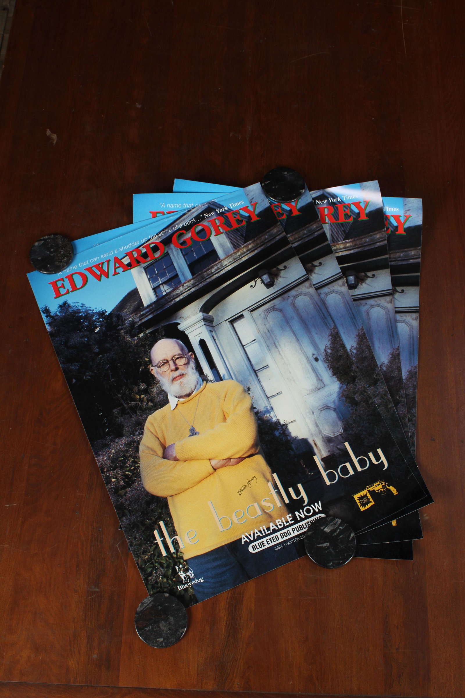 4 Signed Posters for The Beastly Baby by Gorey: 4 Signed Posters for The Beastly Baby by Gorey. Photographic poster featuring Edward Gorey in front of the Elephant House. Each poster signed by the artist and author. Size: 23.5" x 16.5"