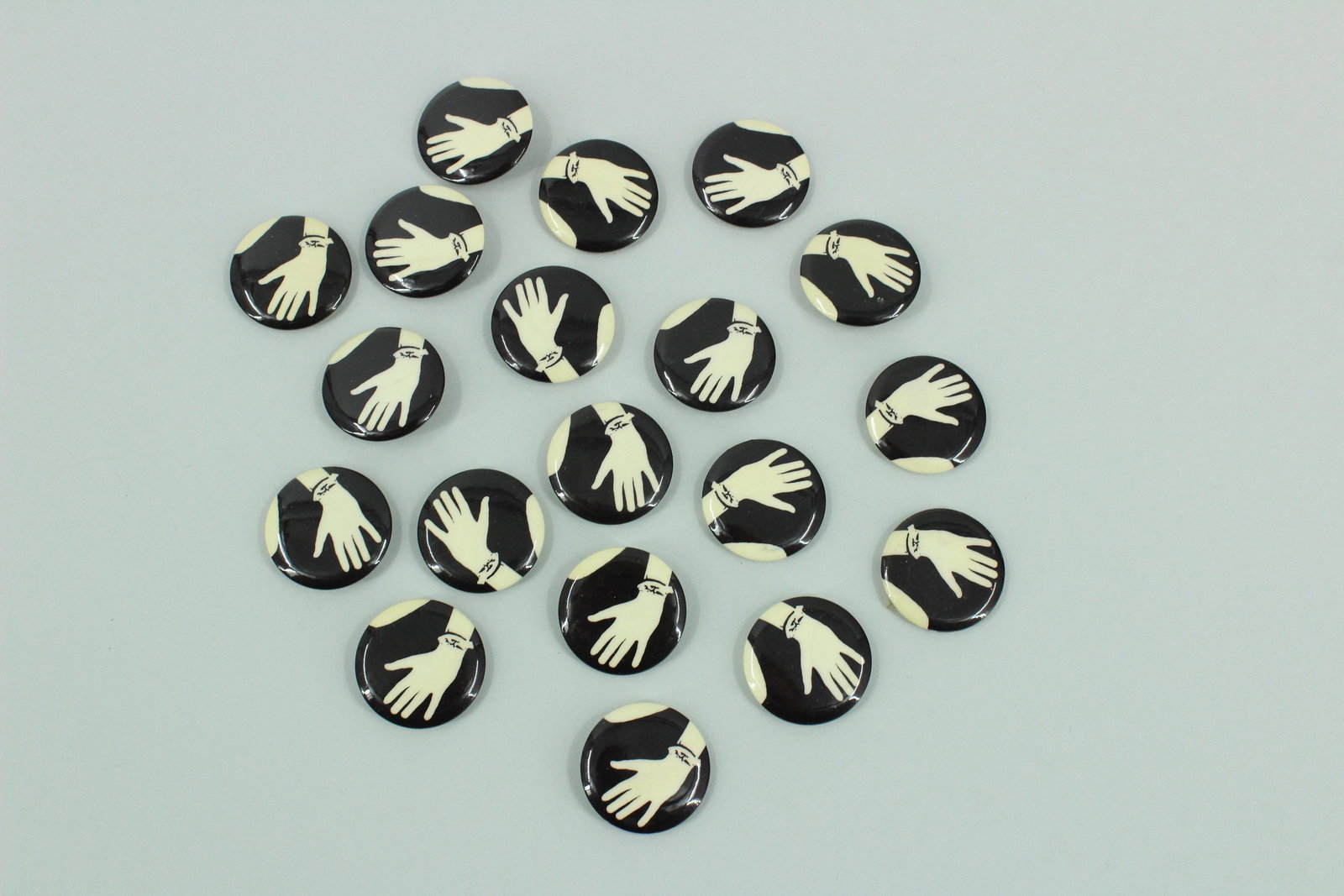 19 Hand Pins: 19 Hand Pins, depicting left hand with a ribbon or string tied around the wrist.