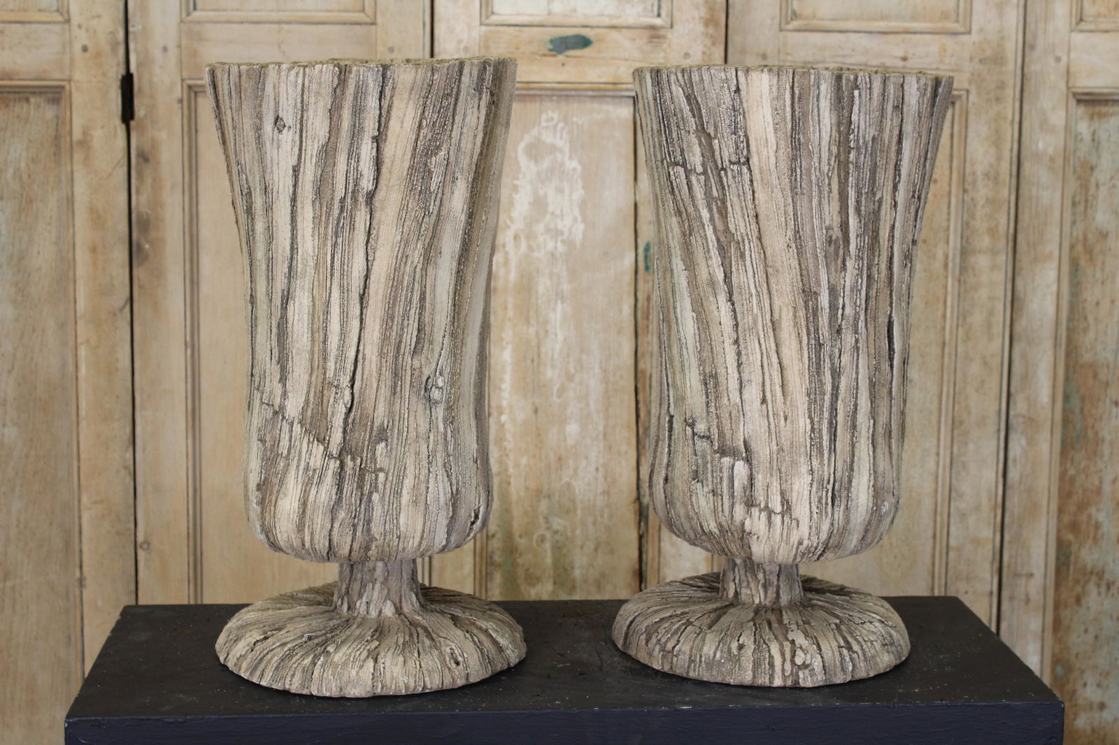 Pair Susy Ventura Faux Bois Planters: A pair of Susy Ventura faux bois cast stone garden planters of well detailed elegant form. 24' x 12" dia.