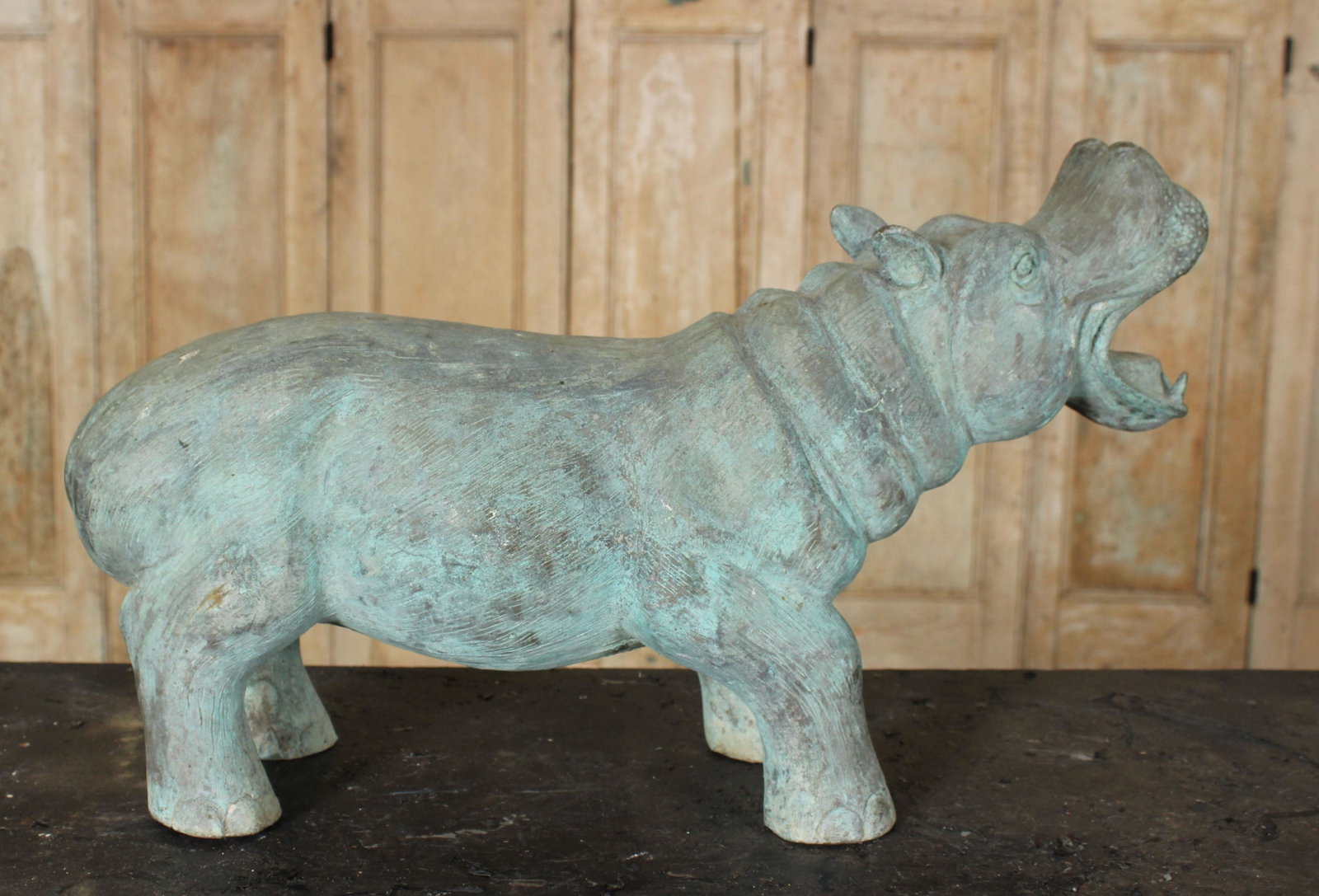 Figural Verdigris Cast Bronze Hippopotamus: A cast bronze hippo garden sculpture with verdigris patination. Size: 12.5" H x 21.5" W x 7.5" D