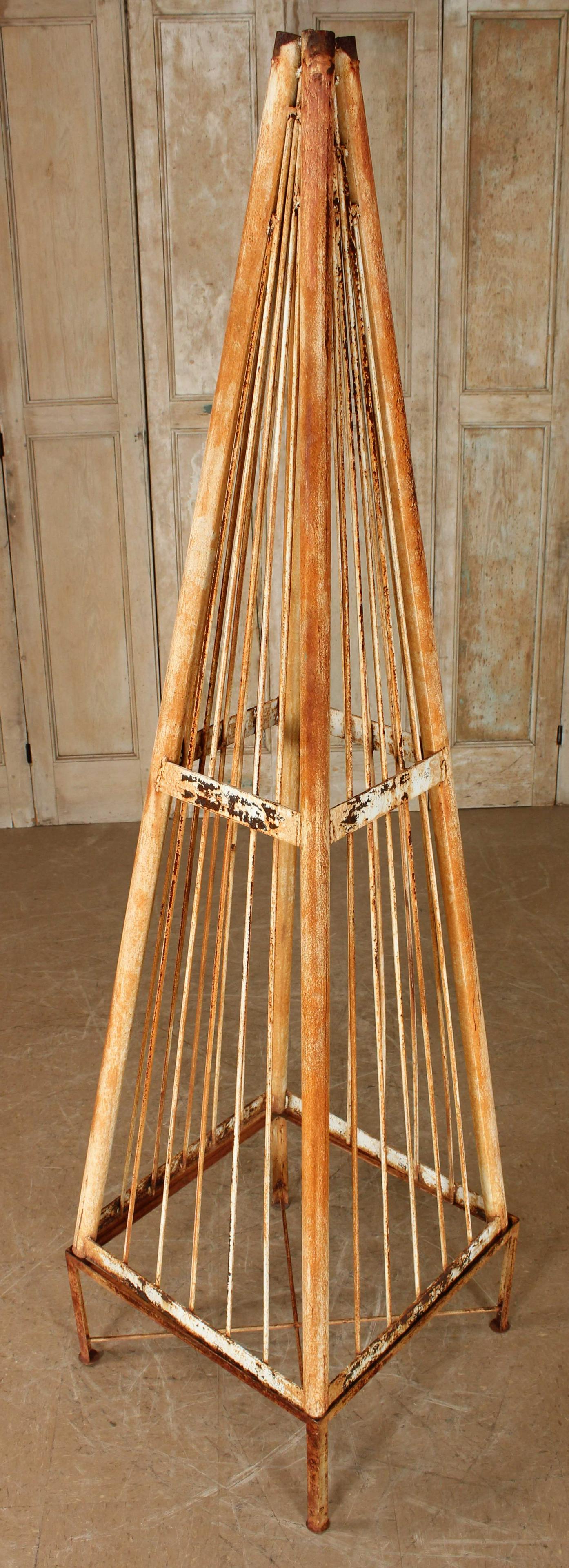 Metal Topiary Form Obelisk: Metal Topiary Form Obelisk. Overall: 89" H 24" x W x 24" D Piece: 79" H x 24" W x 24" D