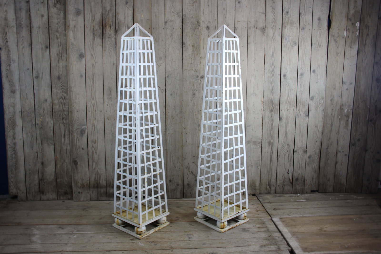 Pair Metal Topiary Obelisks: Pair Metal Topiary Obelisks. Size: 76" H x 16" W x 16" D. ***Please Note: Item to be shipped out of High Point, North Carolina.