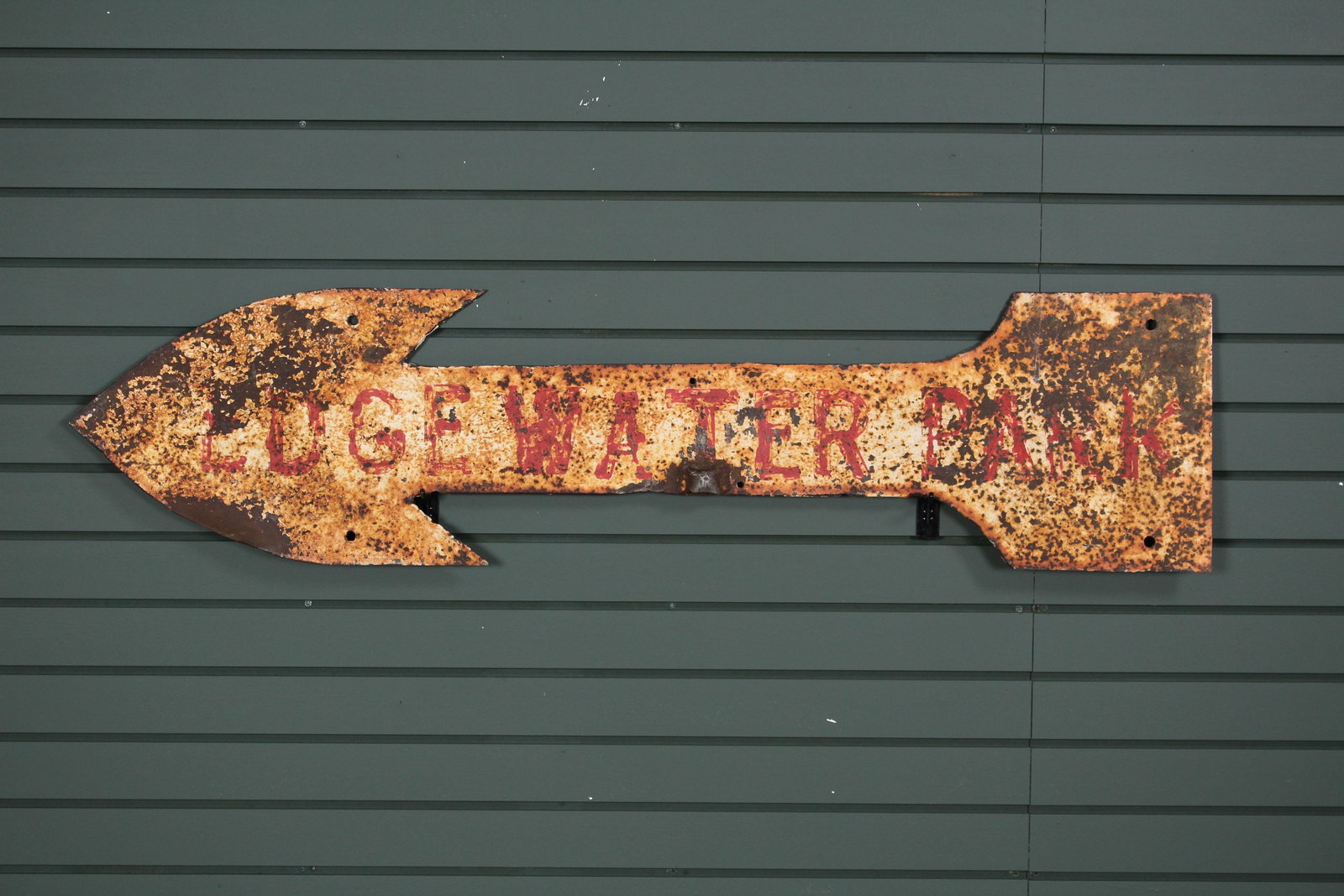 Vintage Arrow Form Directional Trade Sign: Vintage Arrow Form Directional Trade Sign, inscribed Lvge Water Park (?). Sign has remnants of paint decoration. Size: 50" H x 12" W.