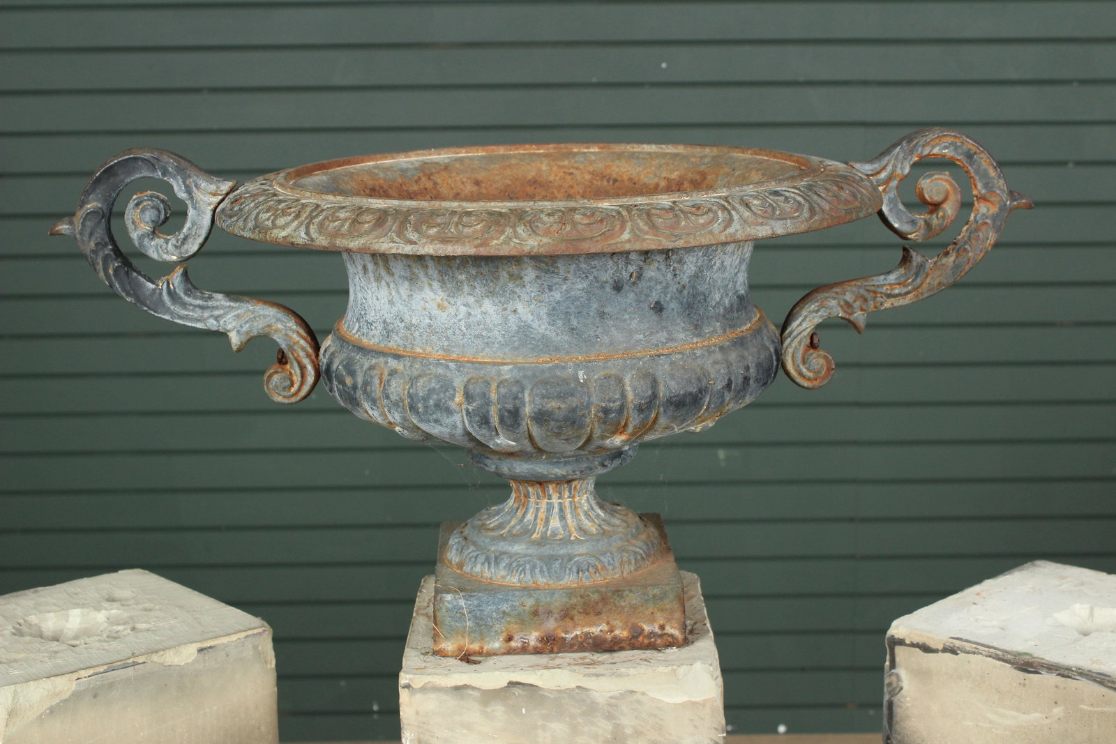 Twin Handled Cast Iron Garden Urn: Twin Handled Cast Iron Garden Urn. Size: 14.5" to top of handles, 13.5" to top of rim, 29" across, 12"Dia. rim.Pedestal not included. Used for photographing item only.