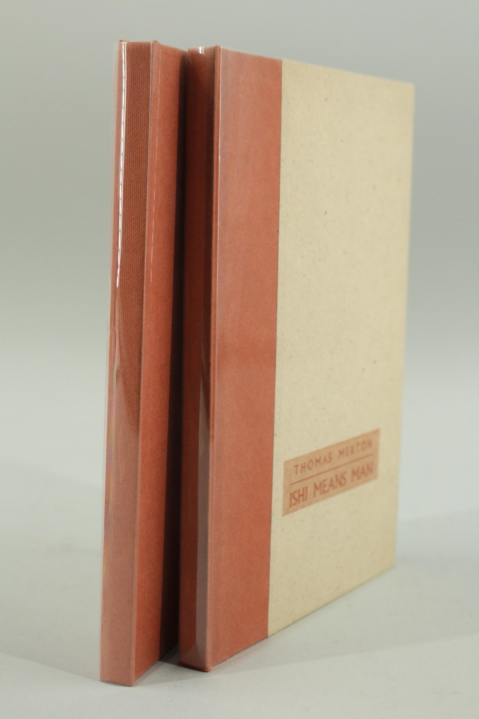 Ishi Means Man Thomas Merton 2 copies: Ishi Means Man by Thomas Merton, Unicorn Press with woodblock by Rita Corbin, 1976. 2 copies. Both fine in mylar dust jackets.
